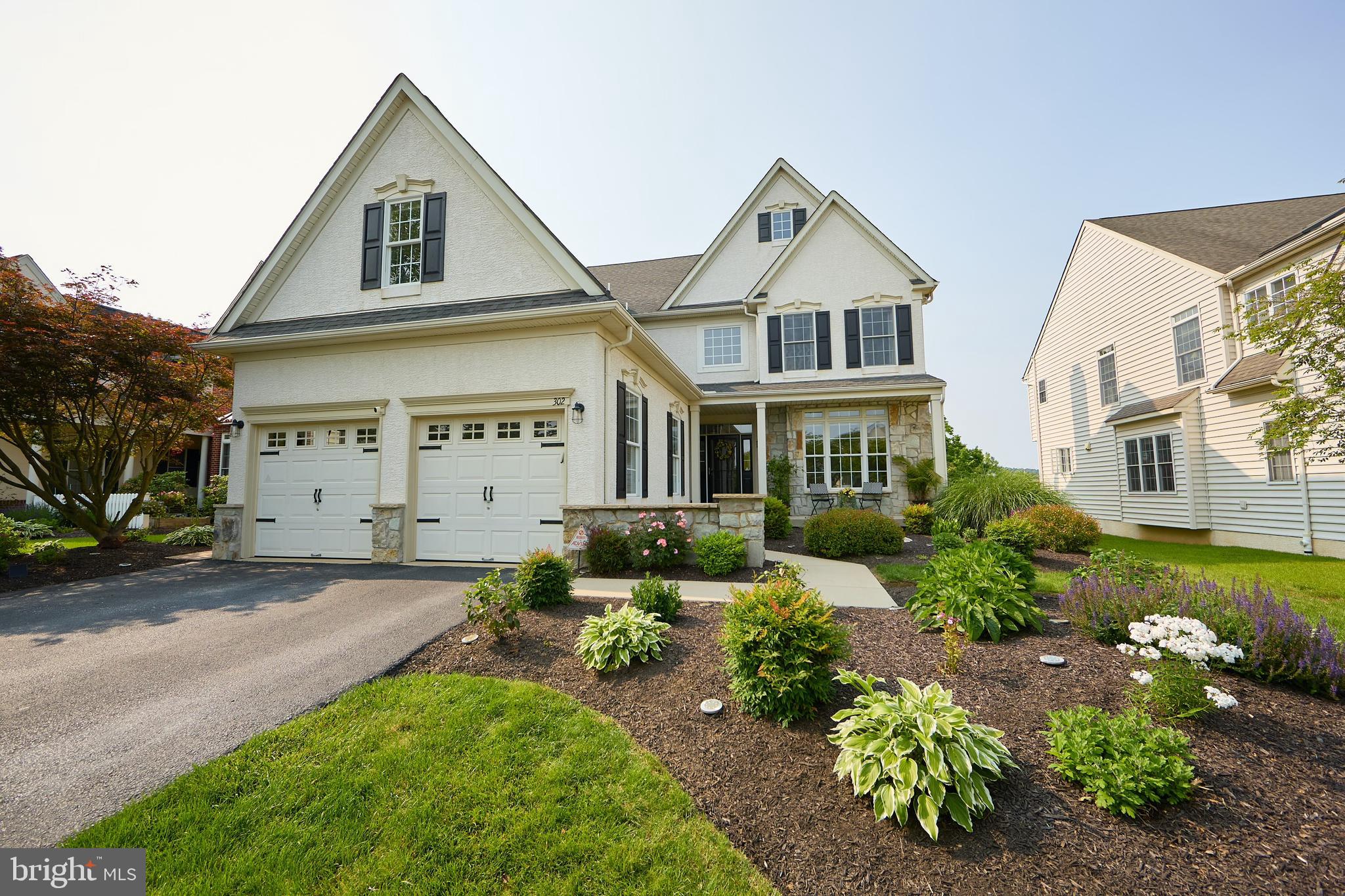 Welcome to 302 Waynebrook Drive, nestled in the charming Reserve at Waynebrook community! Located within the highly desirable Downingtown Area School District and offering access to the prestigious STEM Academy, this home combines tranquility, convenience, and low-maintenance living in a vibrant, well-maintained neighborhood. This beautifully appointed 3-bedroom, 3.5-bath residence boasts a spacious and thoughtful layout that is sure to impress. Classic vinyl siding with elegant stone accents provides excellent curb appeal, setting the tone for the inviting interior.
Step inside to a grand two-story foyer bathed in natural light, opening to formal living and dining rooms—both featuring gleaming hardwood floors, neutral tones, elegant chair rail and crown molding and abundant space for entertaining. The heart of the home is the chef’s kitchen, outfitted with recently updated stainless steel appliances, granite countertops, a timeless backsplash, and custom 42" cabinetry.
Just off the kitchen, step outside to enjoy a private outdoor retreat boasting a deck, well-designed paver patio, and a raised firepit surrounded by Adirondack chairs ideal for cozy evenings under the stars. Lush plantings and landscaping add to the charm and create a truly inviting outdoor oasis perfect for relaxation and social gatherings.
The large two-story family room centers around a gas fireplace, offering the ideal space for quiet evenings. A convenient half bath, laundry room, and access to the two-car garage complete the main floor. Upstairs, you’ll find three generously sized bedrooms and three full baths. The primary suite is a true sanctuary, featuring tray ceilings, oversized windows, and an expansive layout. The luxurious ensuite bath offers a soaking tub, walk-in shower, dual vanities, a private water closet, and a massive walk-in closet. The secondary bedrooms include a lovely princess suite with its own full bath and walk-in closet, and a third bedroom with easy access to the hall bath.
For an additional retreat, the fully finished basement adds impressive living space, complete with luxury vinyl flooring, a built-in bar, and a living area with a built in TV, soundbar, and electric fireplace. A recreational space includes ping-pong and air hockey tables, both of which are included in the sale of the home. The unfinished portion of the basement is ideal for storage. There is easy access to all major utilities and a bilco door for easy access to the outside.
With the HOA taking care of snow removal, mowing, and landscaping, your weekends are yours to enjoy. Ideally located with quick access to Routes 100, 113, the PA Turnpike, and the shops and dining of Exton, West Chester, and Phoenixville! This home truly checks every box.