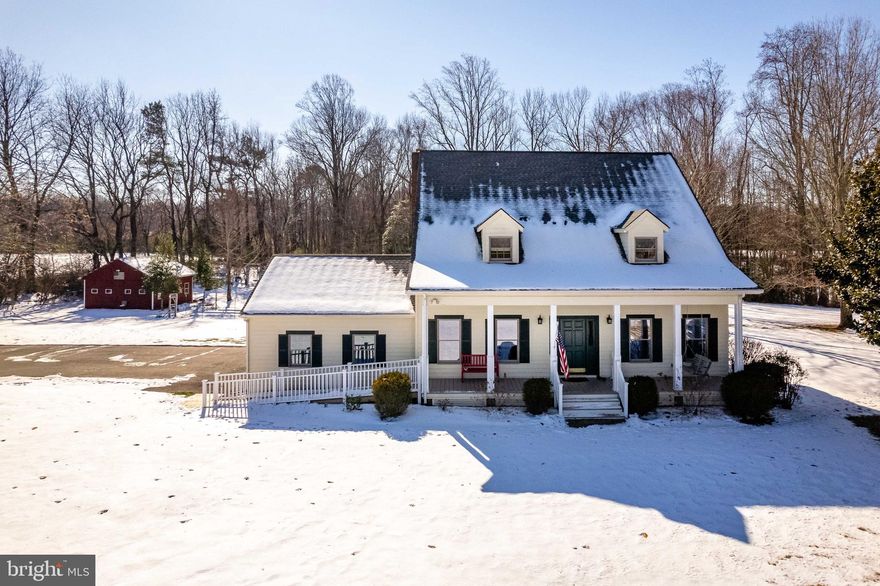 Nestled in the historic heart of Montross, Virginia, this charming 3Br/3Ba Southern Cape Cod offers the perfect blend of classic character and modern convenience. Situated on 1.39 acres of picturesque land, the home has been thoughtfully updated since its purchase in 2020, featuring numerous improvements that enhance both its beauty and functionality.
Fron the moment you arrive, you will be captivated by the inviting curb appeal, complete with the wide Southern-style front porch and porch swing. Inside, the home boasts a warm and cozy environment with a wood burning fireplace (and wood box) and 200-year-old heart-pine floors on the main level, plenty of living area, a beautifully updated kitchen with a huge Butler's Pantry, a primary suite that provides a peaceful retreat, while the additional bedrooms offer ample space for family or guests. The Sunroom on the backside of the home offers a view of the expansive back yard, where you can enjoy the entertainment provided by the wildlife that is so iconic of the Nothern Neck of Virginia. This well-manicured back yard is perfect for gardening, in fact there is a new raised bed vegetable garden that comes with its own deer. In addition, you will have the convenience of an attached garage with a new high quality garage door and added shop lighting as well as a versatile detached garage or craft shed providing plenty of space for vehicles, hobbies or extra storage. Your guests will be in awe of the peaceful surroundings of this private location as well as the historic community. Whether you are looking for a serene retreat or a home rich in Southern charm, this Montross gem is a MUST SEE! A full list of improvements and features of 355 Porter Lane are included in the Documents section.  Lawn equipment negotiable on a separate bill of sale.