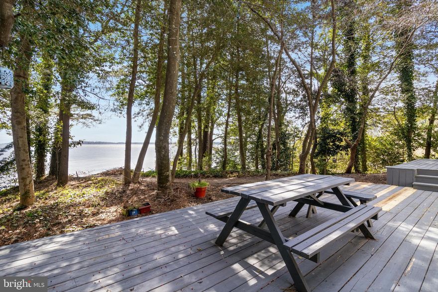 Pied-à-terre on the Chesapeake Bay!  This water view studio is just 75 minutes from Capitol Hill and is the perfect getaway. It offers privacy, has been completely painted, carpets cleaned and is immediately usable... just a short walk to the community path and beach! The bay views are memorable, and most will admire such a find.  Be part of the Drum Point community, with lakes and beaches, boat ramp and wide streets for walkability. This property is sold AS IS, WHERE IS.