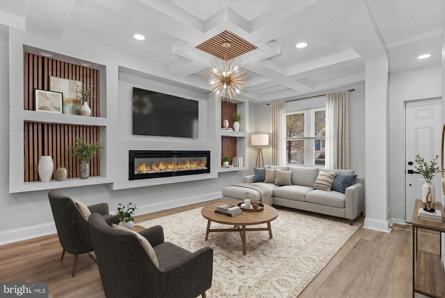 Welcome to 441 N Lakewood—fully renovated with a clean, modern aesthetic and warm, upscale finishes throughout. Honey-toned LVP floors span the main level, anchored by a statement fireplace with custom wood paneling and tray ceilings, all complemented by sleek brushed gold lighting.

The kitchen is crisp and contemporary with quartz countertops, stainless steel appliances, and pendant lighting, flowing seamlessly into expansive living and dining spaces designed for both everyday living and entertaining.

Upstairs offers three well-sized bedrooms and two full baths, including a standout primary suite with beautiful tilework and refined vanities.

The finished lower level adds versatility with a fourth bedroom, full bath, and flexible space for an office, rec room, or guest suite.

Fenced rear yard and a wide street with convenient perpendicular parking complete the package.

Ideally located just minutes from Johns Hopkins, Patterson Park, Canton, and Fells Point, with easy access to I-95, I-895, and downtown Baltimore—perfect for commuting, dining, and enjoying everything the city has to offer.