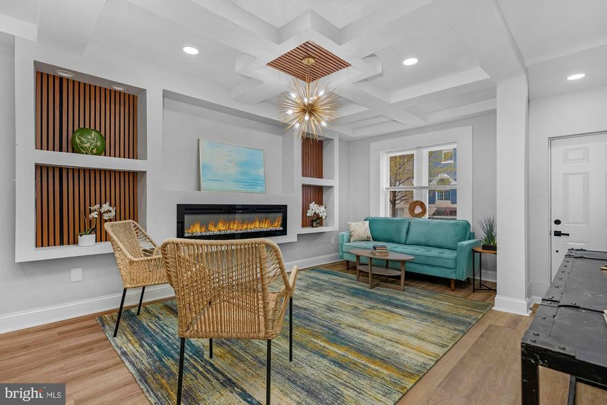 Welcome to 441 N Lakewood—fully renovated with a clean, modern aesthetic and warm, upscale finishes throughout. Honey-toned LVP floors span the main level, anchored by a statement fireplace with custom wood paneling and tray ceilings, all complemented by sleek brushed gold lighting.

The kitchen is crisp and contemporary with quartz countertops, stainless steel appliances, and pendant lighting, flowing seamlessly into expansive living and dining spaces designed for both everyday living and entertaining.

Upstairs offers three well-sized bedrooms and two full baths, including a standout primary suite with beautiful tilework and refined vanities.

The finished lower level adds versatility with a fourth bedroom, full bath, and flexible space for an office, rec room, or guest suite.

Fenced rear yard and a wide street with convenient perpendicular parking complete the package.

Ideally located just minutes from Johns Hopkins, Patterson Park, Canton, and Fells Point, with easy access to I-95, I-895, and downtown Baltimore—perfect for commuting, dining, and enjoying everything the city has to offer.