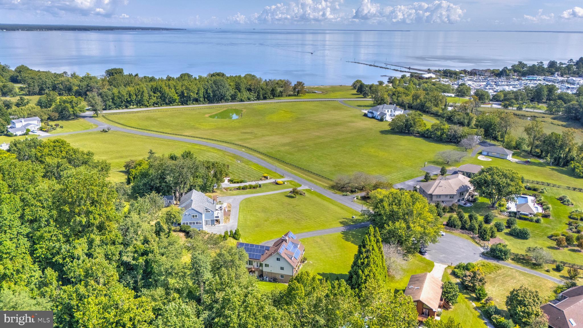 Welcome to your private bayfront retreat with sweeping, panoramic views of the Chesapeake Bay. This fully renovated residence blends luxury, comfort, and functionality, offering breathtaking water views from all three levels. Every detail has been thoughtfully crafted to create a home that’s both effortless to live in and unforgettable to entertain in.
At the heart of the home, the expansive sunroom showcases a dramatic wall of windows framing the bay—an inspiring backdrop for both everyday living and gatherings. The luxurious primary suite offers a serene private retreat, while a separate guest level, complete with its own living room and bath, ensures comfort and privacy for visitors. A chef-inspired kitchen with a large island keeps the cook connected with family and friends, and cozy wood-burning fireplaces on each level add warmth and charm year-round.
Nestled within a picturesque waterfront community, residents enjoy a private beach perfect for swimming, kayaking, and paddleboarding. From the deck and front rooms, watch the ever-changing bay—boats heading to the marina, sailing school lessons in motion, and cruise ships passing in the distance. You’ll even have front-row seats to Herrington Harbor’s dazzling fireworks displays.
Just steps from the Chesapeake Bay, this location offers unrivaled lifestyle opportunities with nearby deep-water marinas, a scenic bayfront boardwalk, waterfront dining, and all the activities of “Bay Life.” Despite the tranquility, commuting is effortless with quick access to Washington, D.C., Annapolis, Northern Virginia, and beyond.
Here, you’ll wake to spectacular sunrises, enjoy gentle bay breezes, and savor a peaceful escape that feels worlds away—yet keeps you close to everything you need.