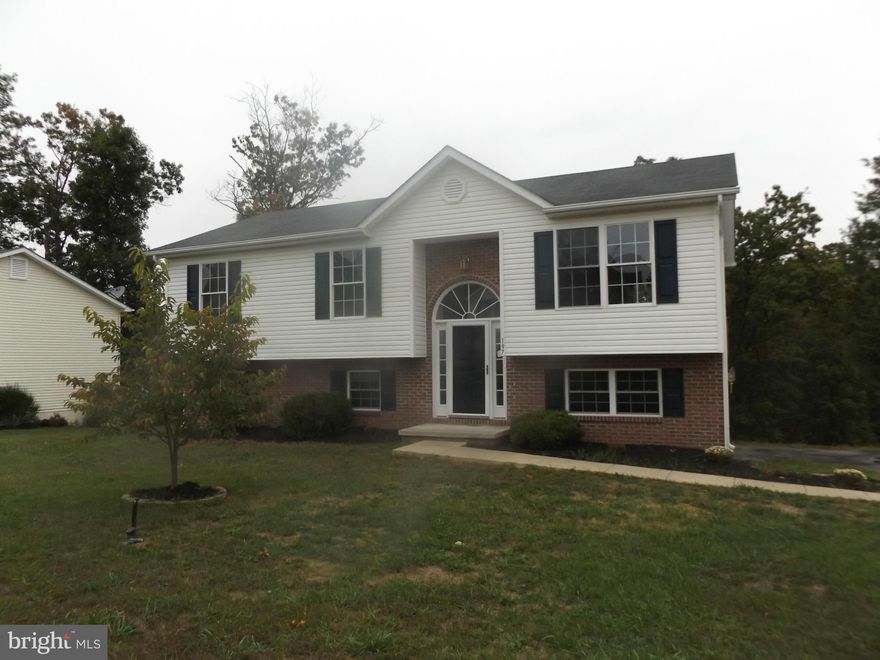 Freshly painted and ready to go! This 3 bedroom, 2 bath home features new carpet, new kitchen cabinets and countertop, new stove and microwave. Finish the progress in the basement for extra square footage and a rough in bath with tub is ready to be put to use! Lots of potential! New heat pump unit will be installed prior to settlement.
