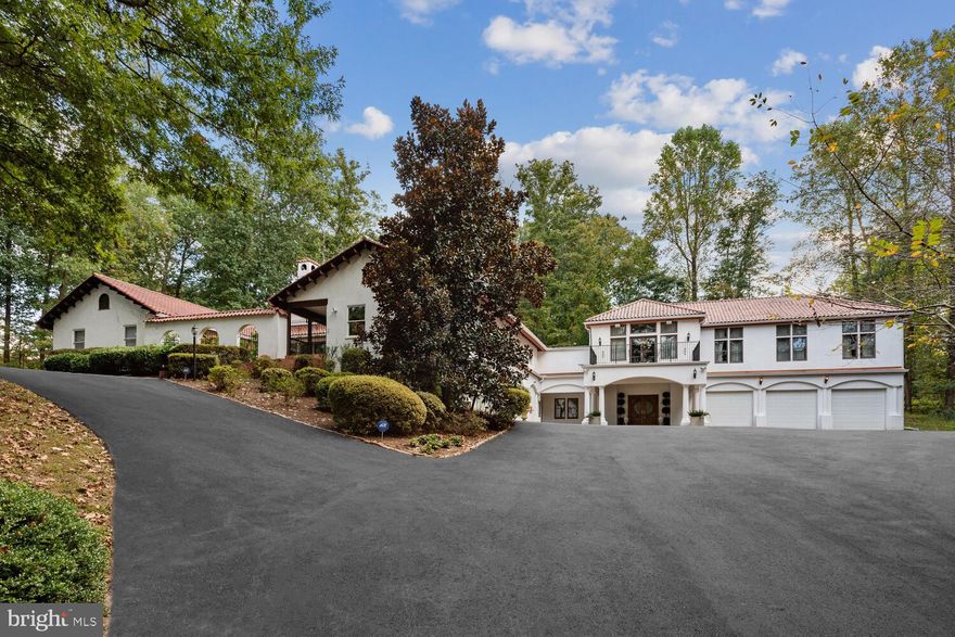 BACK UP OFFERS BEING ACCEPTED!
Absolutely stunning residence with 5 bedrooms,  7 1/2 baths offers impressively large space for both family and gracious entertaining.  Whether you enter the main level or upper level through the gorgeous courtyard, this home offers details like no other.  Unique custom staircase and railing leads to the Grand Library, Formal Dining Room and lovely outdoor space through the French Doors.  The walk-behind Wet Bar and Bar Area is perfect for entertaining.  The Gourmet Kitchen with adjacent Breakfast Area open to the Family Room and Fireplace.  Access the large deck for outdoor living.  There is also an adjacent Catering Kitchen designed to cater large events, enhancing the convenience of hosting and cooking for guests.  The Primary Bedroom includes a sitting room with fireplace, Extra large walk-in closets and updated bath.  Two additional bedrooms each with en suite bathrooms.  There is even a spiral staircase that leads to a loft area with a full bath.  The ground level is just perfect for multi generation families and includes a beautiful bedroom with en suite bath, WIC, separate entrance into kitchenette and dining areas, Media room, storage and so much more to this special offering.  
Overall, this home seems to have it all - with over 10,000 sq. ft of living space, luxurious features, convenient amenities, and a desirable location in the Langley HS pyramid - it's a wonderful place to call home!