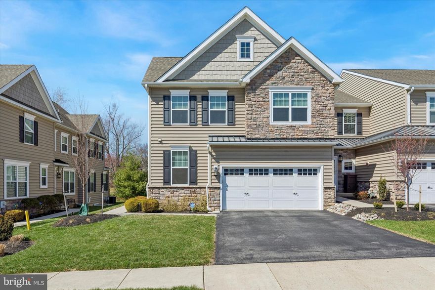 Welcome to 31 Penn Manor Court! This beautifully appointed carriage home is the largest model in Penn Manor, offering an impressive 2,880 square feet of living space—plus 1,000 square feet of a fully finished basement.  Designed for both comfort and convenience, the home features a two-zone, split  HVAC system with a 4-ton unit and a private elevator providing easy access to all three levels.  In addition, the homes offers a two-car garage with an epoxy floor.  Upon entry, you’ll find a versatile office or flex room to the right, along with a spacious formal dining room—perfect for hosting family and guests. The open-concept layout seamlessly connects the family room and kitchen, creating an ideal space for entertaining. The family room is enhanced by stunning custom built-ins, while the kitchen boasts an island, eat-in area, upgraded GE Cafe appliances, and a Fisher & Paykel double-drawer dishwasher. Step outside to the expanded deck—perfect for relaxing or entertaining on warm summer evenings. A convenient powder room completes the first floor. Upstairs, the second level offers three generously sized bedrooms, two full bathrooms, and a dedicated laundry room. The primary suite is a true retreat, featuring an en-suite bath with a soaking tub, double vanity, and separate shower. It also includes two large walk-in closets and an additional bump-out space—ideal for a home office or sitting area. The finished basement adds even more living space and includes a home theater system (with an additional system in the family room). Additional upgrades include a 1.5-year-old Bradford White water heater, a 10.5-year-old roof, and a whole-house water softener. Ideally located with easy access to the PA Turnpike, Route 309, as well as nearby shopping, dining, and trails.