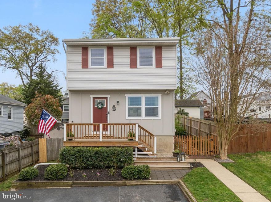 Welcome to this turn key, move in ready home in Woodland Beach!  Picture perfect with designer touches throughout this 4 bedroom, 2 full and 1 half bath colonial.  Open concept main level with updated kitchen, neutral paint, designer inspired lighting and hardwood flooring.  3 spacious bedrooms on upper level and a full bedroom suite as the lower level- complete with walk out.  Fully fenced and manicured rear yard.  Close to shopping, dining & entertainment. Easy commuter access with Downtown Annapolis just minutes away. Schedule your private tour today!