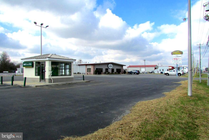 Highly visible location. It is situated on 113 in Frankford. The property comprises 2 parcels, for a total of 4.88 acres.  The property is located at a traffic light in the southbound lane of 113 DuPont BLVD. in Frankford. This location allows for several ways to access the parking lot with frontage on not only 113 but also Rd.402. This commercial listing has potential for several entities, the building currently houses Shore Appliance which resides in 6,600 sq. feet. The building has a remaining 7,150 sq. feet of space for lease. At the back of the parcel is a gated and fenced storage area (30,000 sq. feet) To the front of the parking lot   M&T Bank has a free-standing ATM. The roof, garage doors, and parking lot were all recently renovated. An already approved sign completes the highly desirable location. The Potential of this property is unlimited. Book your showing today.  The listing is tax Parcels #433-6.00-33.00, and #433-6.00-31.02.