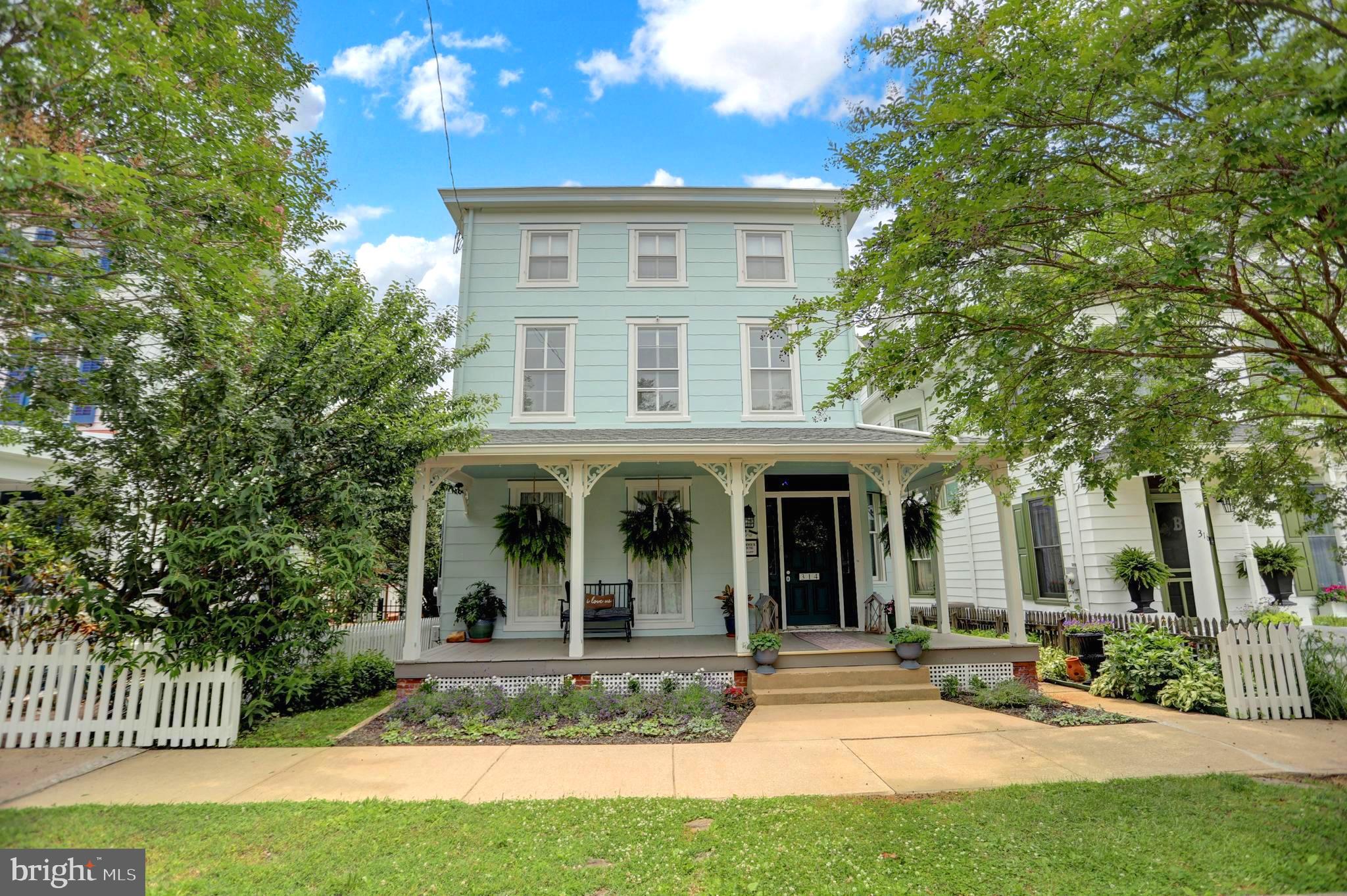 If you are looking for a beautifully designed Victorian home in a quaint waterfront small town with a marina, this is the one for you! This turn-key historical home has been thoughtfully designed with an Airbnb or vacation home use in mind, complete with custom decor and carefully selected antiques, to instantly transport you into another world. Only steps from the small town of Chesapeake City along the famous C&D Canal, you can enjoy the many town events, shops, cafe, waterfront restaurant, ice cream shop, marina, and more! This home has been carefully renovated to make it shine and have modern conveniences while maintaining its Victorian charm. The wrap-around front porch welcomes you to the home and features a plaque naming this the "Barwick House" circa 1850. Walking into the front door, you are greeted by the lovely foyer with a vestibule seating area. To the left of this is a living room with electric fireplace and beautiful mantle. The dining room has been opened to the kitchen which makes it a welcoming space to entertain. This room is a showpiece with exposed ceiling, dual chandeliers, large dining table, custom island and cabinetry utilizing antique furniture to take the charm to the next level! Off the kitchen is a laundry room, mudroom, and a sunroom which could also be used as a first floor bedroom or bonus room. There is also full bathroom with ADA walk-in shower and intricate detailing in the design with nods to the Maryland waterfront setting. The second floor has one of the best features of the house: the first bedroom not only has beautiful exposed beams, but it also features custom stairs up to a secret loft, perfect for a kids hide-out or reading nook, with railing hand-wrapped with nautical rope to create a magical getaway experience! This second floor has two more bedrooms, one with exposed beams & loft-style decor ledge and the other with double closets and built-in shelves, and the second full bathroom with clawfoot tub. The third floor has two bedrooms, one which has a beautiful feaux-fireplace mantle. There are 5 bedrooms total in this home, plus the bonus room/sunroom on the first floor, and 2 full bathrooms. Outside, you'll find a large deck to enjoy all summer long, as well as a spacious back yard - only a few blocks from the Marina! This property has convenient off-street parking for up to 6 cars in the back and there is permitted parking along the street. The mechanicals have also been updated for buyer's peace of mind, including New Roof 2023, New Electrical & Panels 2022-2023, New Wall Mini-Split Heating/Cooling 2022, added insulation, and much more! This is a one-of-a-kind gem that you will not want to miss!