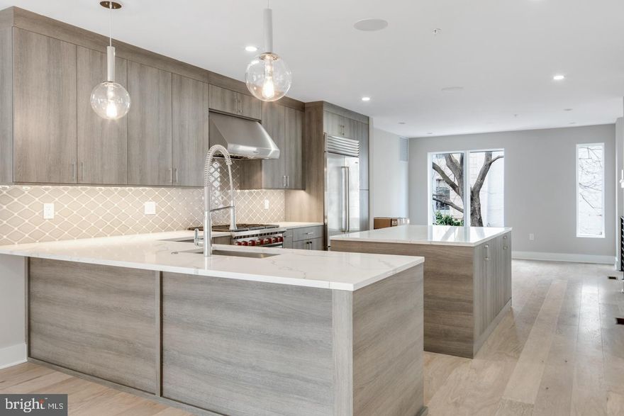 24 Foot wide new construction home with 2-Car Garage, Roof Deck, Elevator, Tax abatement, multiple outdoor spaces and amazing floor plan all within the Greenfield School Catchment in the Logan Square area of Center city Philadelphia. This home is 100% complete! Just above Rittenhouse Square. Top of the line design and construction by the city's premier architect and developer. The designer kitchen has top of the line sub-zero and Wolf alliances, amazing stone counter tops and a huge deck for entertaining. In addition to the huge roofdeck there is also a very large deck off of the living room perfect for entertaining.Tall ceiling heights, smart home system, phenomenal views and more. Enter your new home through the 2 Car Garage with Private Driveway. 4 Bedrooms plus media room, additional office and additional play room.. 4 full Baths and 2 half baths. Finished Basement . Energy Efficient Dual HVAC Systems. Security Alarm with 2 Keypads. Video Intercom System & Home automation system. 8' Solid Core Interior Doors. Metal Handrails/Railings on Stairs. Wood Stairs with stained risers and treads.Tax Abatement Pending. Take advantage of this once in a lifetime opportunity while it still lasts. These homes are selling quickly... . walk to the Comcast center, Rittenhouse, Fairmount Park, Riverwalk and more. Still time to customize and pick finishes.  Check OPA for 2019 taxes due to possible citywide reassessment. private trash fee $22.50/mo. pictures are from another unit in the same development. square footage included below and above grade space. square footage estimated.This property is also known as 212-3 N 21st.Square footage total includes above grade space and below grade space and is estimated.