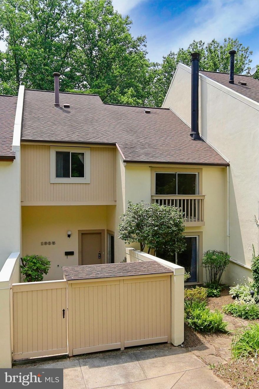 This residence offers a perfect combination of modern living and natural beauty!  The contemporary home includes so many special, difficult-to-find features: a quiet, private location within a few minutes walk of the cluster dock where you can store your kayak/canoe,  cluster tot lot and picnic area and a short walk to Lake Anne Plaza.   The Wiehle Metro stop is just a few minutes drive, and bus service is available on Wiehle near Inlet Ct.  This is a perfect home for someone looking for that fabulous location, and who is willing to do some renovation/up-dating to make it their own.  Enter the spacious tiled foyer from the fenced and gated front patio.  The large living and dining room spaces feature a marble surround on the wood-burning fireplace for a touch of warmth and charm, and access to a front garden from the sliding glass door in the living room.   An arched doorway leads to the kitchen with its up-dated white appliances and a window overlooking the rear deck.  Double pantries offer loads of space.  The family room features a high ceiling with custom built-in cabinetry and architecturally interesting windows over the sliding door to the deck.  Unwind and bask in the serenity of your private deck with space for family and friends to enjoy summer bar-be-cues.  Surrounded by heavily wooded common ground, it is both quiet and private with wonderful views in all seasons.  Level two features a large primary suite, entered through double doors, with a separate sitting room, two customized closets and a full bath.  Level three has two more bedrooms, each with ample closet space, and a shared full bath with a large linen closet.  The stairs to the lower level include a powder room space.  If you're interested in a pool or ping-pong table, this lower level is ideal!  Lots of space in both the recreation room and the hobby room for extra office/playroom/guest spaces .  The walk-out from the hobby room leads to a large brick patio with access to the pathway and common ground.  One carport and one reserved space belong to this townhouse.  The updates include thermopane windows have been added in the kitchen, the sitting room and the family room sliding glass door to the deck.   Other replacements include the refrigerator 2019, the roof in 2005, the attic fan in 2012, the gas furnace and kitchen stove in 2017, the humidifier in 2013, the dishwasher in 2012 and the A/C compressor in 2018.  These are all estimates based on receipts and serial numbers.  One reserved carport conveys and one reserved parking space conveys.  Home conveys in "as is".  Don't miss the opportunity to make this home your own!  You're going to love living here!