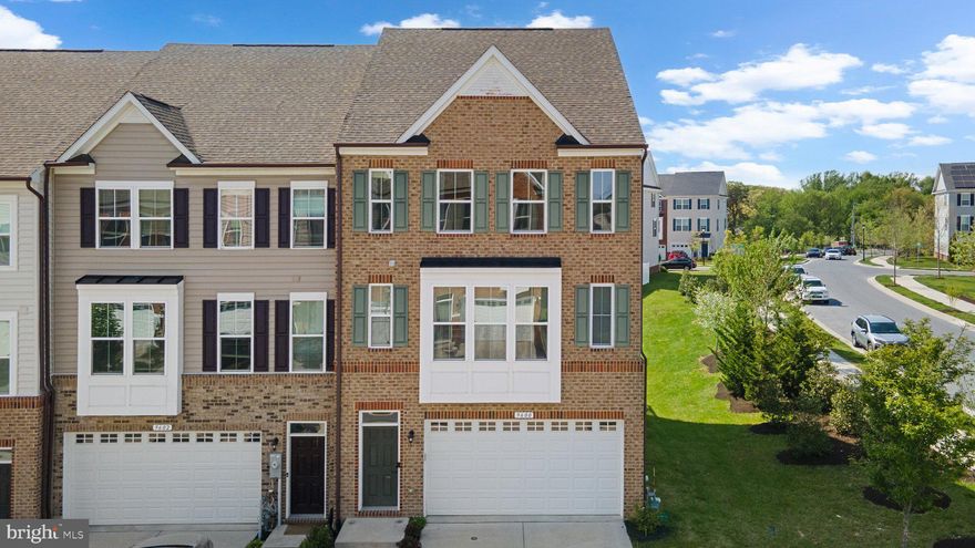 Welcome to this beautifully designed 3-bedroom end-unit townhome featuring a bright, sunlit open floor plan on the main level. The stylish kitchen boasts a large center island with seating, stainless steel appliances including a gas cooktop with a microwave range hood, and flows seamlessly into the dining area with access to a spacious deck—perfect for outdoor entertaining. Adjacent is a comfortable family room, ideal for relaxing or hosting guests. Luxury vinyl plank flooring, a convenient half bath, and a versatile home office complete the main level. The home's 4-foot structural extension provides the extra space for the home office as well as a full-size pantry, while also allowing for larger rooms on both the lower and upper levels.

Upstairs, you'll find a full hallway bathroom, a laundry nook, and three generously sized bedrooms, including a spacious owner's suite with an en-suite bath featuring a double sink vanity. The versatile lower level offers a full bathroom, garage access, and a flexible space ideal for a media room, home gym, or even a potential 4th bedroom, along with direct access to the backyard.

As an end unit, this home enjoys additional windows that flood the space with natural light. With a 2-car garage and thoughtful layout, this home offers both style and functionality in a desirable setting