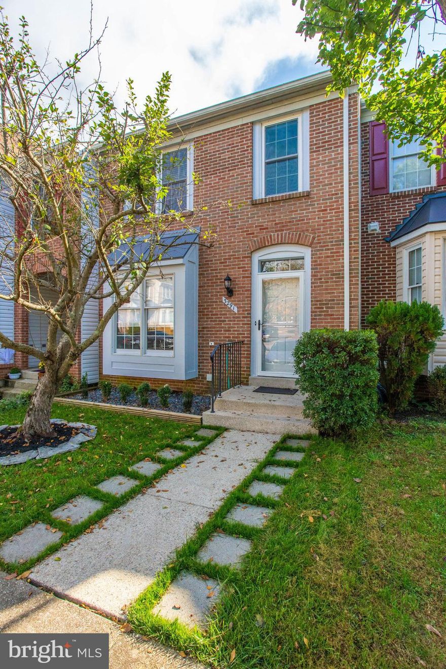 Spacious Heron model townhome in Lake Ridge features a unique sunken living room with a two-sided fireplace, spacious dining room, and an updated kitchen with quality stainless steel appliances, breakfast nook and access to a new deck with custom spiral staircase. Downstairs is a terrific basement remodel with easy care floors, recessed lights, a modern full bathroom and a bonus room...perfect for office or guest quarters. The second floor includes a primary bedroom with vaulted ceilings, an electric fireplace and an ensuite bathroom with soaking tub and separate shower. Another full bath and two more bedrooms complete this level. The home features a smart systems for the lighting and main door lock, a newer roof and heat pump, closet systems, many new windows. Ideally located in this amenity-rich community, backing to woods and with a fully fenced yard.