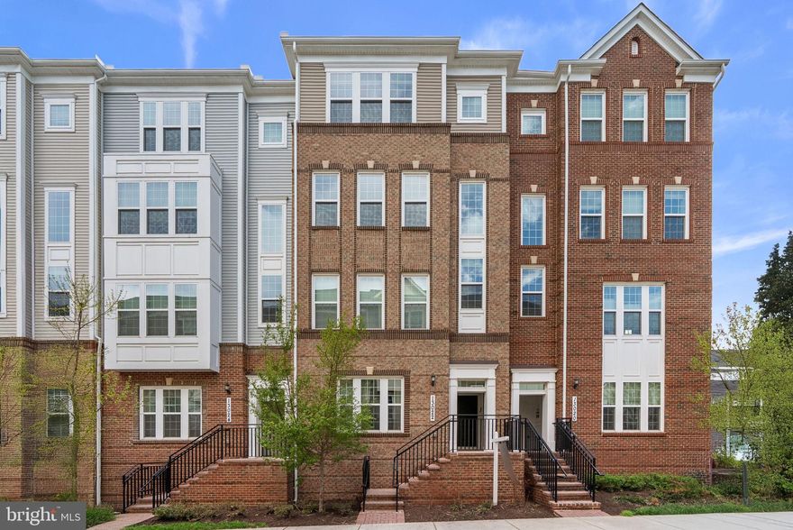 Welcome to this beautifully-designed home in the highly desirable Clarksburg Town Center. Behind a stylish, mostly brick front exterior, this 2,443-square-foot residence delivers a polished, move-in-ready experience without compromise.

The main level is designed for effortless entertaining and daily routine, encompassed by large windows that flood the space with natural light, gorgeous hardwood floors, and fresh paint throughout. At the center of the home is a high-end, eat-in kitchen built for real life. Featuring premium quartz countertops, a tiled backsplash, and a large statement island, it serves as the perfect prep space or gathering spot for weekend breakfasts. The layout flows directly into the expansive living and dining areas, keeping you connected with guests, while an adjacent covered balcony offers a quiet space to step outside. The living room is equipped with 5.1 home theater prewiring, and the living room, family room, and primary suite contain HDMI and media prewiring. Custom router and home networking prep located in the living room and the second-floor hallway, with Ubiquiti routers installed in both locations.

Upstairs, brand new carpet creates a comfortable, quiet retreat. The primary suite provides a generous layout, a large walk-in closet, and an en-suite bathroom, equipped with a dual sink vanity, to help you recharge at the end of the day. Two additional spacious bedrooms, a full bathroom, and a flex space offer the flexibility you need for a dedicated home office, a fitness room, or welcoming guest accommodations. A walk-in laundry room rounds out the upper level and makes for easy, convenient living.

Life here extends into a vibrant community. Enjoy access to the resort-style pool, clubhouse, playgrounds, and scenic walking trails. With immediate proximity to I-270, Clarksburg Premium Outlets, and upcoming retail hubs, your commute and weekend errands are completely streamlined. Schedule your private tour today to experience this beautifully-maintained home in person.