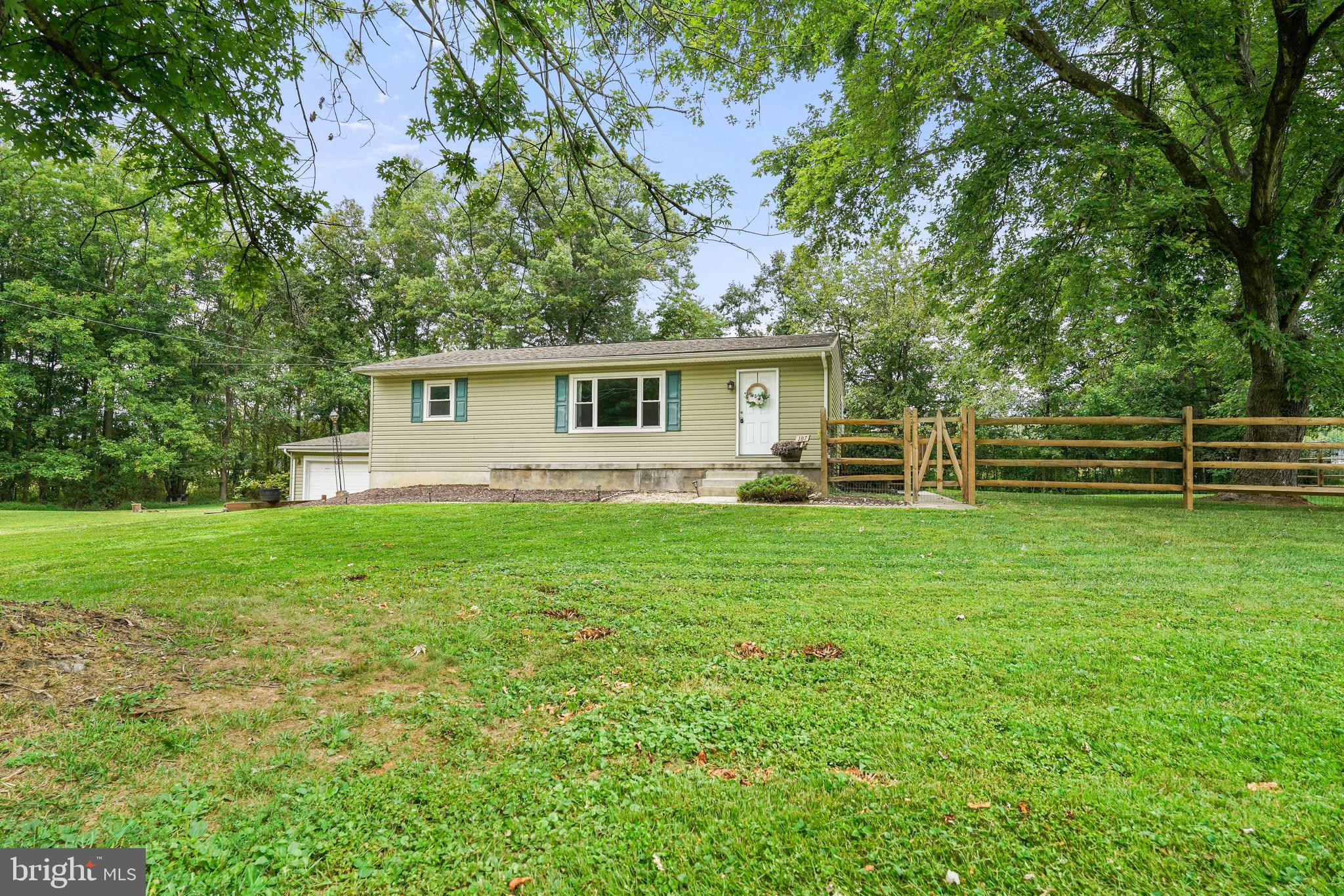 Charming single-family rancher with an oversized two car garage, perfectly situated on one full acre in a peaceful rural setting. Inside, you'll find beautiful hardwood floors flowing through much of the home, a spacious living room, and a bright, open kitchen featuring ample cabinet space, a large island, wine bar, and rustic open shelving. Step outside to enjoy the expansive deck, fenced yard, and even a chicken coop (chickens included!) for those who love a touch of homestead living (sellers are willing to remove if homesteading isn't for you). The home offers a large basement with finished areas, plus a second full bath in the basement that just needs final plumbing hook-up to be fully operational. Updates include a new water heater (2023), all new windows (2017), refaced all kitchen cabinets and added additional new cabinets plus the island (2020), new deck (2023), new fence (2024). With plenty of space both indoors and out, this property combines modern comfort with country charm. Convenient to Fair Hill Natural Resources Management Area, I-95, and centrally located minutes from Pennsylvania and Newark, DE.