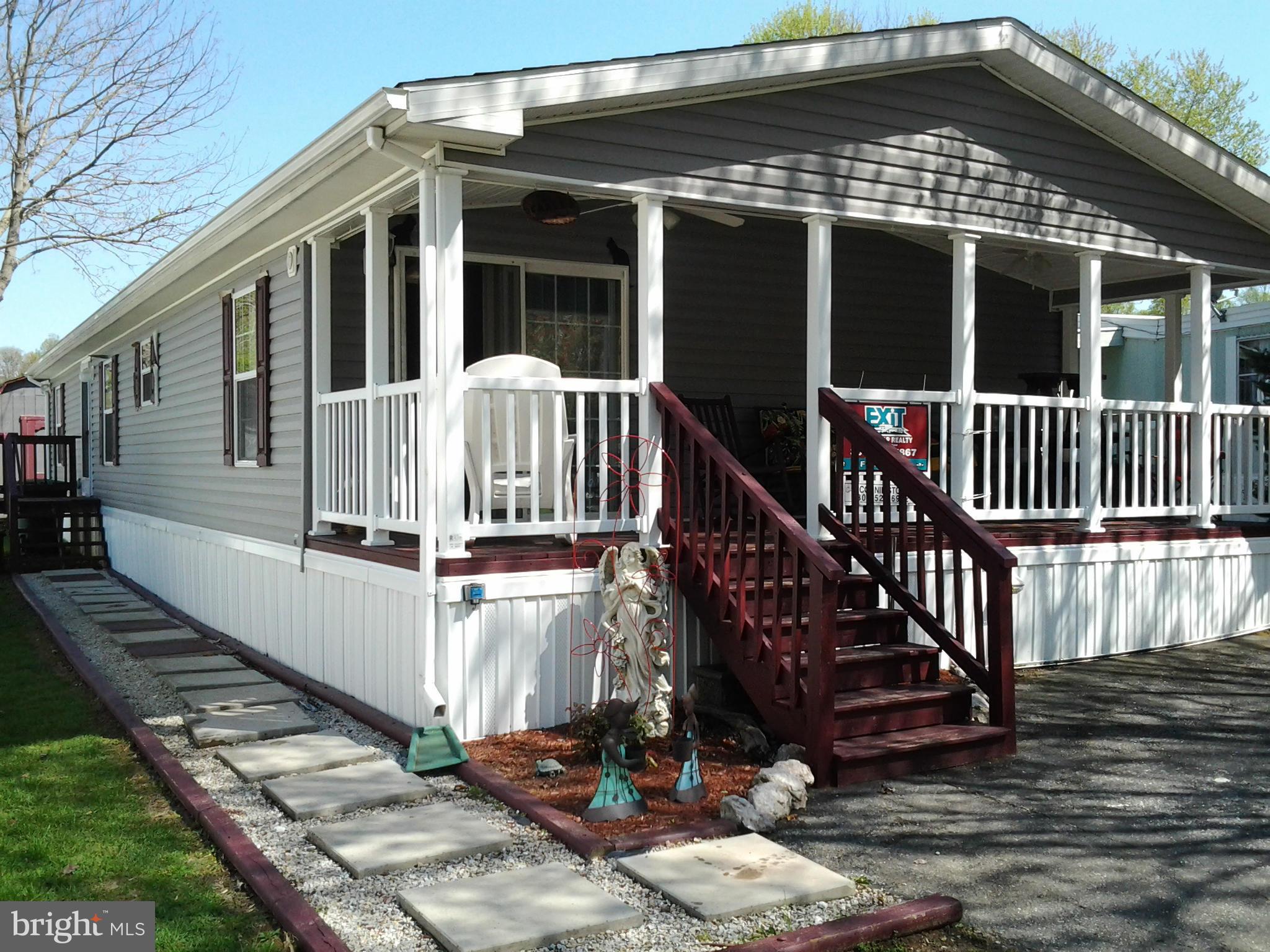 This is a wonderful open Floor Plan. Enjoy this Summer on you 23' covered deck. well Landscaped yard. Cul-de-sac. Boones Mobile home park offers Swimming Pool, Tennis Courts, and Basketball. Large living room with fireplace in corner. Use as 1 big room or add a formal dining table to the opposite side of the room. Large country kitchen with lots of cabinets.