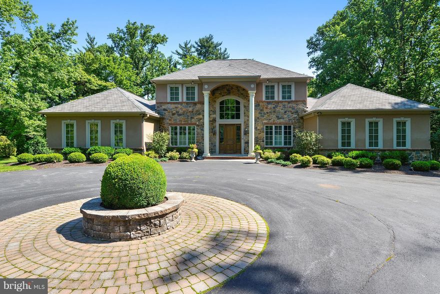 Extraordinary Mediterranean style manse w/beautifully executed traditional flair. Alan Klatsky custom home featuring the finest of finishes. Sensational gourmet kit w/island & breakfast rm. Large family rm. Luxurious 1st fl master suite w/his & her marble baths. 3 en suite BRs & BAs on 2nd flr. LL offers spacious club rm w/new custom mahogany bar & gas FP; exercise rm; office/br5 & full bath.