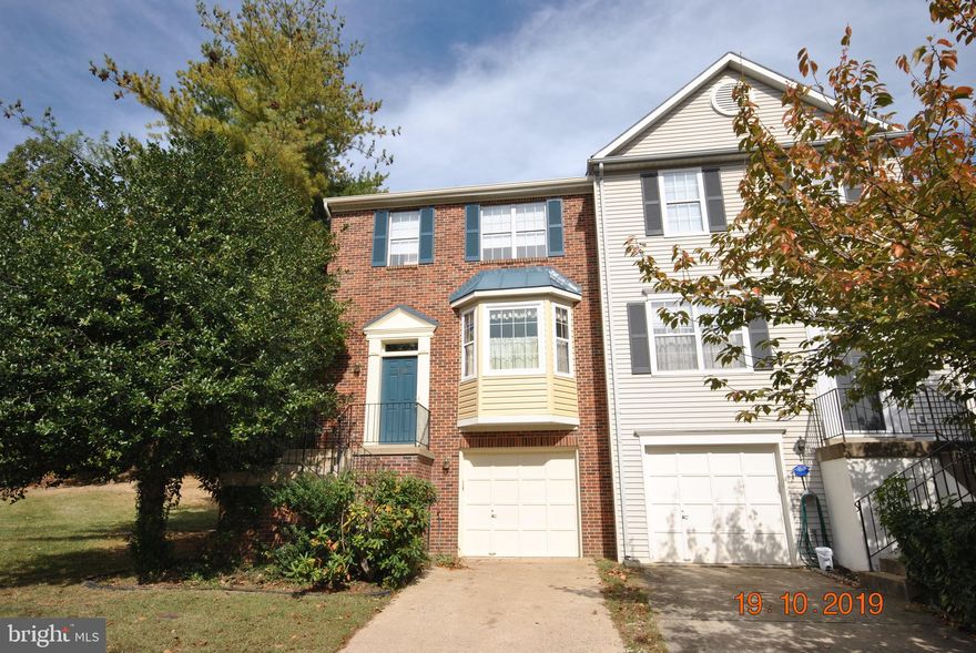 Excellent location, convenient to everything! Very Nice 3 level brick front end townhome. This home features a new roof, ceramic tile kitchen floor, newer refrigerator, security system, freshly painted foundation, large Master Bedroom with vaulted ceiling, Master bath with soaking tub, separate shower and double bowl vanity, basement rec room with built Ins and walkout to patio that backs to trees, carpets have just been professionally cleaned, living room has built ins and gas fireplace, dining room is open to the living room, deck, bay window in kitchen with a window seat, newly installed radon remediation system along with new radon report, large side yard, some of the windows have been replaced and the Fireplace and chimney were just cleaned and inspected. Stop by and see how nice this well maintained home is...