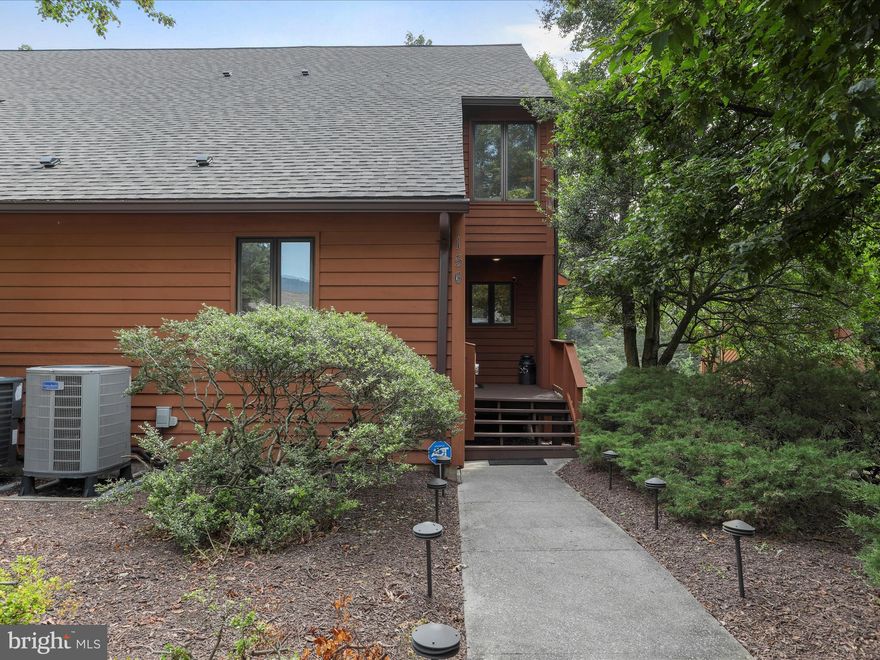 Polished Perfection on the 17th Fairway
156 Tecumseh Trail | Class A Membership Available

This beautifully maintained end-unit townhome offers one of the most sought-after vantage points in Tomahawk Ridge—directly overlooking the 17th fairway of the Mountain View Golf Course.

Immaculate in every sense, the home showcases tasteful upgrades and exceptional attention to detail. Vaulted ceilings throughout create an airy sense of space and understated grandeur, while thoughtfully placed storage solutions add practical ease. From the granite kitchen with stainless appliances to the spa-inspired primary suite, every space reflects refined comfort and timeless design.

Highlights include:

- Updated kitchen with granite countertops and newer appliances
- Entry-level guest bedroom with nearby updated full bath
- Cozy great room with gas fireplace, sliding door access to the open-air deck, and peaceful fairway views
- Vaulted ceilings throughout, adding volume and light
- Primary suite with private deck access, custom tile walk-in shower, double vanity, and dual closets
- Multiple outdoor living spaces, including a deck-level storage unit with a full-size refrigerator that conveys
- Smart TV and soundbar in the great room convey
- Ample closets and extra storage throughout

Enjoy the low-maintenance lifestyle that comes with Tomahawk Ridge’s quarterly cluster fee—which covers most exterior upkeep—and the added bonus of being within walking distance to the Clubhouse, Grille, outdoor pool, and Pro Shop.

A Class A Family Membership to The Woods Club is available, unlocking access to exclusive resort-style amenities including championship golf, indoor and outdoor pools, a sports center, tennis courts, pickleball, spa services, and more.