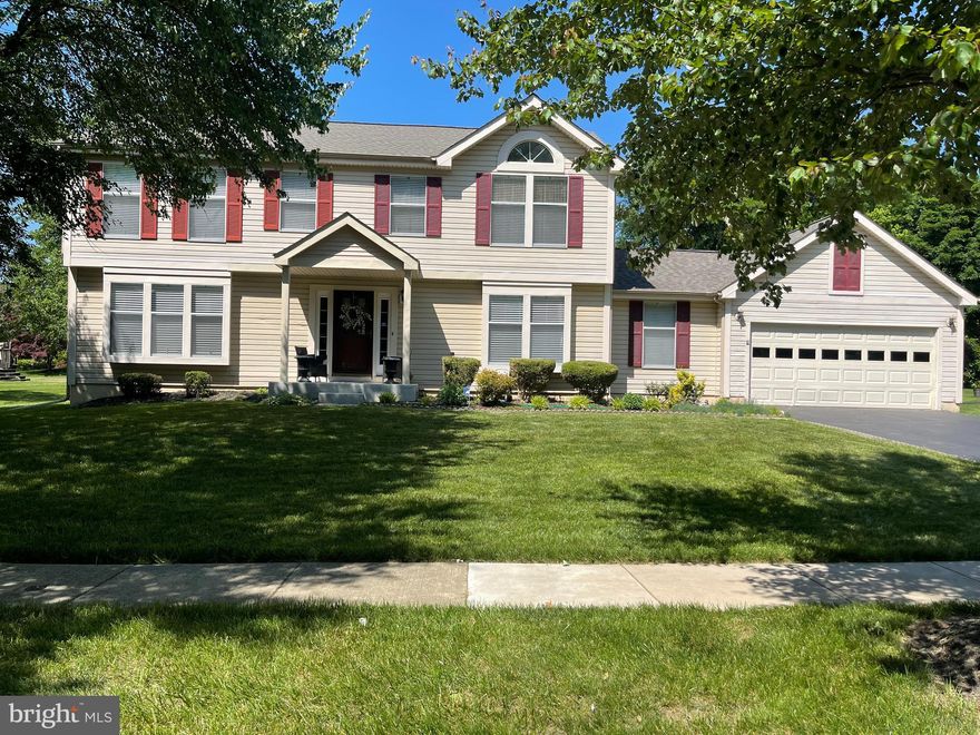 Spacious well maintained 5 bedroom, 3 1/2 bath colonial style home in quiet neighborhood.  The main level boasts a carpeted living room and formal dining room with crown & chair rail molding, family room with a fireplace, hardwood flooring, access to a deck and fabulous backyard, a breakfast area, kitchen with a center island, granite countertops and stainless-steel appliances.  The main level also has a powder room, private office with hardwood flooring, and access to a large 2-car garage.  The upper level has 5 bedrooms with ceiling fans, newer carpeting and a full bathroom in the hallway.  The master bedroom has a vaulted ceiling, hardwood flooring, and a full master bathroom.  The basement is fully finished, including a wet-bar, built-in shelving, and a full bathroom.