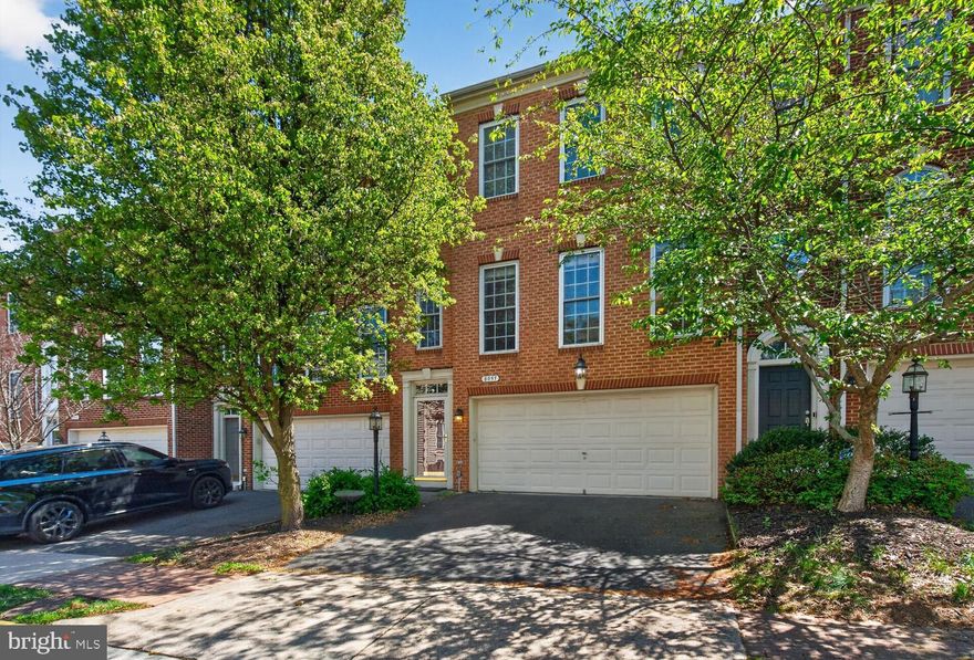 OPEN HOUSE Sun. April 19, 1-4  Stunning, light-filled Carnegie model brick-front townhome offering 3 BR & 4 Baths (2 full, 2 half), thoughtfully designed to combine space, flexibility, & everyday comfort.  Enjoy peace of mind with recent upgrades, including a recent HVAC system (2020) & hot water heater (2022).

Inside, an abundance of oversized windows fills the home with natural light, beautifully highlighting the open floor plan. The main level features gleaming hardwood floors, an expansive living room, & a formal dining area that flows seamlessly into an enormous eat-in chef’s kitchen. Complete with a breakfast bar, generous table space, & even a cozy nook perfect for reading or enjoying tea, this kitchen is truly the heart of the home.

Step outside to the spacious composite deck—ideal for grilling and outdoor entertaining. Upstairs, the impressive primary suite boasts a vaulted ceiling & ample space to accommodate even the largest bedroom furnishings.  This suite is complete by a bath with two sinks & separate shower/soaking tub & wonderful, walk-in closet.

The walkout lower level offers incredible versatility, perfect for a home gym, recreation room, or media/theater space. From here, access the fully fenced backyard featuring both a patio and deck—creating a private outdoor retreat ideal for entertaining, relaxing, or unwinding in the evenings.

Perfectly situated in a highly desirable, commuter-friendly location, this home offers exceptional convenience minutes  to Fort Belvoir,  the Pentagon, Washington, D.C., the Lorton VRE station, & Reagan National Airport. With easy access to Interstate 95, the Lorton  Library & Community Center, Whole Foods  just around the corner, or one of the two neighborhood pools, this location blends connectivity with community amenities.

A 3D virtual walkthrough is also available, allowing you to explore the home from anywhere & experience the layout firsthand.