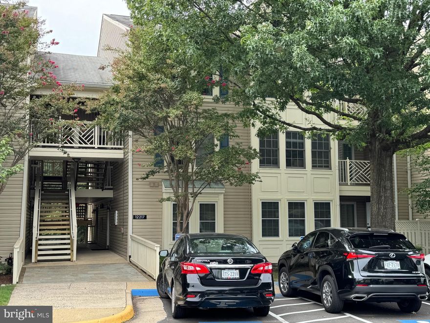 Welcome to 2-bedroom, 2-bathroom 1st level condo, where comfort meets convenience! Each bedroom features its own ensuite bathroom, offering privacy and ease, while the primary suite boasts a spacious walk-in closet. The sunroom floods the home with natural light, creating the perfect spot for morning coffee or a cozy reading nook. Hardwood floor throughout, marble floor in the foyer. Step out onto the patio with a private fence and extra storage, ideal for enjoying fresh air year-round. This home has been freshly painted with SW send white color.  Granite kitchen countertops as well as new stainless steel appliances. so you can move in with peace of mind. The laundry/storage room comes with a full-size washer and dryer, making everyday tasks effortless. Enjoy the amenities-rich community, featuring a tennis court, scenic pond with a gazebo, and picnic area—perfect for outdoor relaxation. Nestled next to Ox Hill Battlefield Park, you’ll have green space at your doorstep. Plus, you’re just one block from Fairfax Towne Center, where you’ll find Safeway, a movie theater, shopping, and dining. With quick access to I-66, Routes 50, 29, and 28, and a short drive to Fair Oaks Mall, Fairfax Corner, and Fair Lakes Shopping Center, this location is unbeatable. Don’t miss the chance to make this move-in-ready condo!