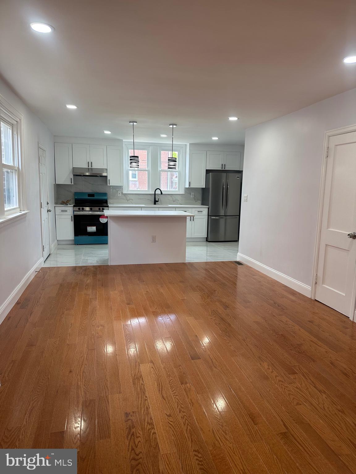 Fully Rehabbed Twin in Northeast. Hardwood floor on first floor with open kitchen, 42" wood cabinets, granite countertop, center island stainless steel appliances and ceramic tile floor. Walk downstairs into the fully renovated basement with ceramic tile floor and a full bath with 3 pc bath with standing shower. Second floor has waterproof three nice size bedrooms and 3 pc bath with bathtub, tile floors and wall. New Heating & Cooling HVAC System. New windows throughout and Freshly painted. Garage door has been ordered and will be changed out