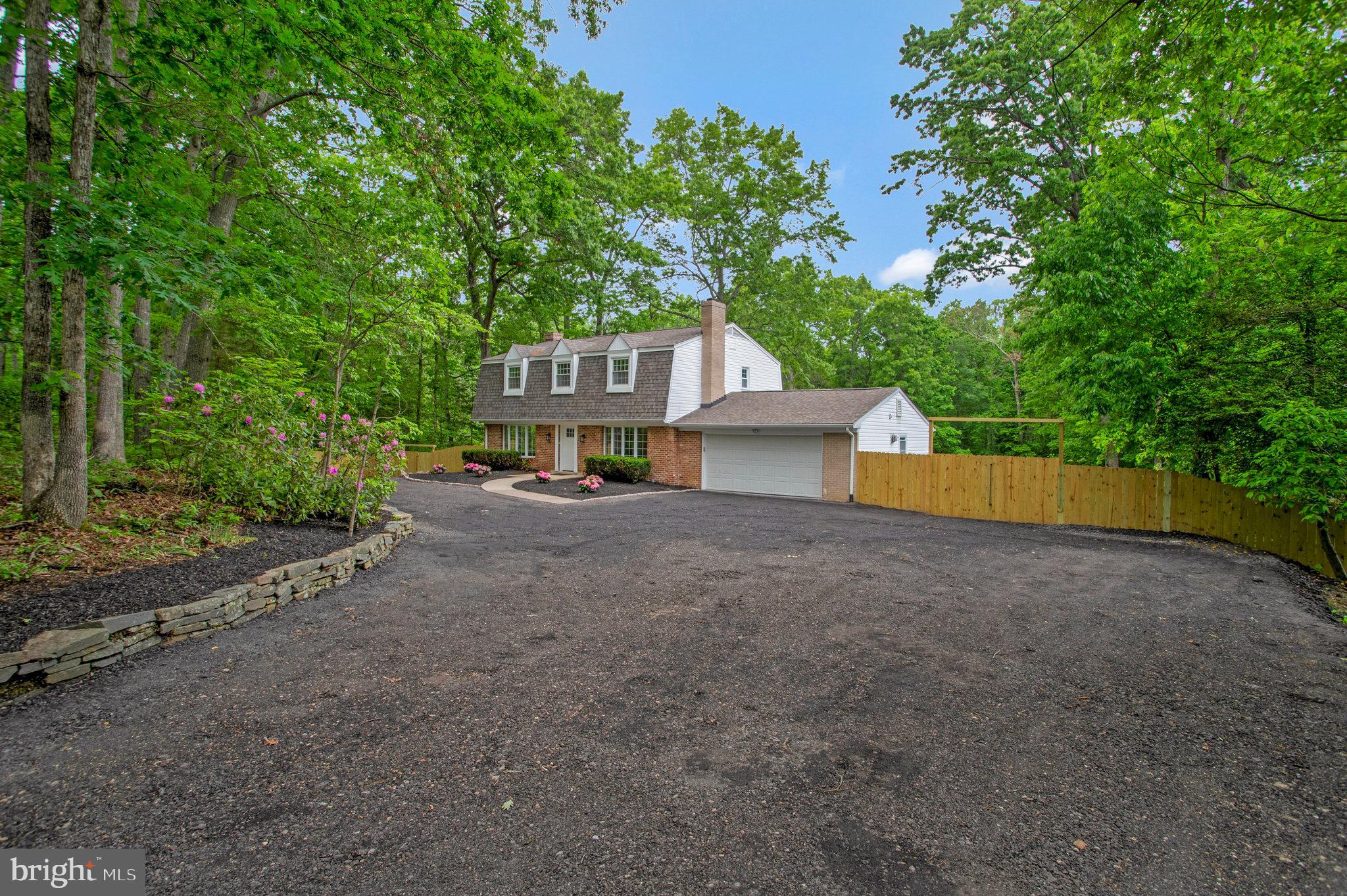 Limited service listing. These 4 bedrooms + den/bonus room, 3.5 baths colonial is surrounded by natural beauty on almost 2 acres! Fully updated kitchen featuring Samsung SS appliances, white cabinets and quartz counters. Hardwood floors and tiles throughout. Basement level is fully finished with rec area, full bath and den/extra room. New HVAC, electrical and plumbing fixtures, appliances, washer/dryer and much more. Enjoy large, wooded back yard with swimming pools, fully fenced and all nature that comes with that.