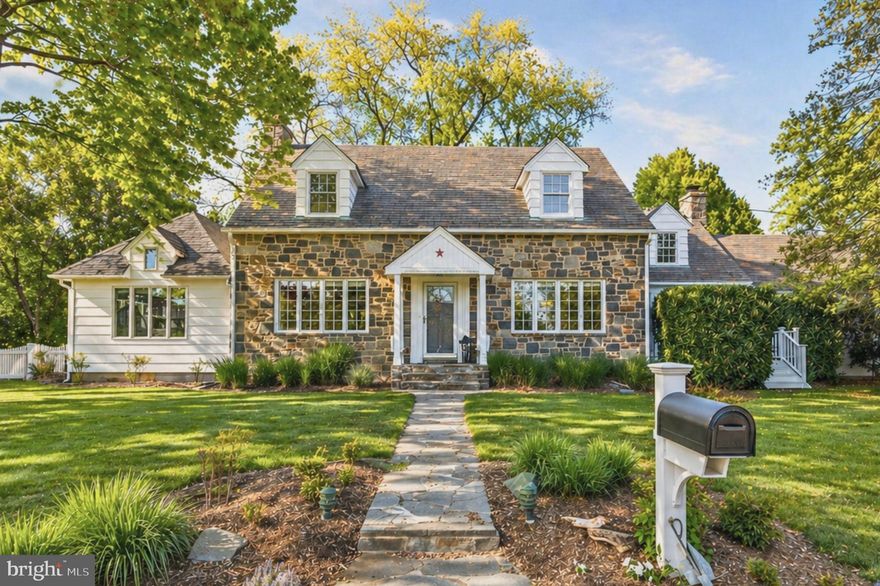 Classic Cape Cod charm. Coastal soul. Completely reimagined.

Fieldstone facade. Half-acre flat yard. One block to the Severn River marina.

1948 Cape Cod in sought-after Pendennis Mount blending original character with thoughtful updates throughout. Slate roof, cobblestone paver drive, and blooming azaleas set the tone from the start.

The living room welcomes you with hardwood floors, a stone wood-burning fireplace, and access to the back deck. White barn doors open to a sun-filled vaulted room with three walls of windows. Renovated full bath on the main level.

Formal dining flows into the updated kitchen featuring granite countertops, glass-front white cabinetry, and a gas island with bar seating. Open to both the breakfast room and the game room. The game room stands out with warm knotty pine walls, a gas stone fireplace, pool table, front porch access, and direct connection to the backyard.

Upstairs, the primary suite offers multiple closets and a beautifully remodeled bath with jetted soaking tub, frameless glass shower, and walk-in closet with laundry, plus additional attic access. Three more spacious bedrooms and a renovated hall bath with skylight complete the upper level.

Lower level offers 1,488 sq ft of unfinished space currently used as a home gym, with workshop area, built-in cabinetry, and extensive storage including crawl spaces with concrete flooring. Walk-up stairs provide direct access to the backyard deck, adding convenience and flexibility, while the open layout leaves plenty of room for future finishing or continued use as-is.

Set on a flat, half-acre fenced corner lot with deck, putting green, frisbee golf course, potting shed, and mature landscaping. A Cold War-era underground bunker tucked into the yard adds a unique and memorable historical element.

Two-car rear-entry garage. Just one block to the private Severn River marina with boat slips, kayak storage, sandy beach, and views of the Naval Academy and downtown Annapolis. Broadneck schools.

OFFER   DEADLINE Saturday 5/2 @ 6pm