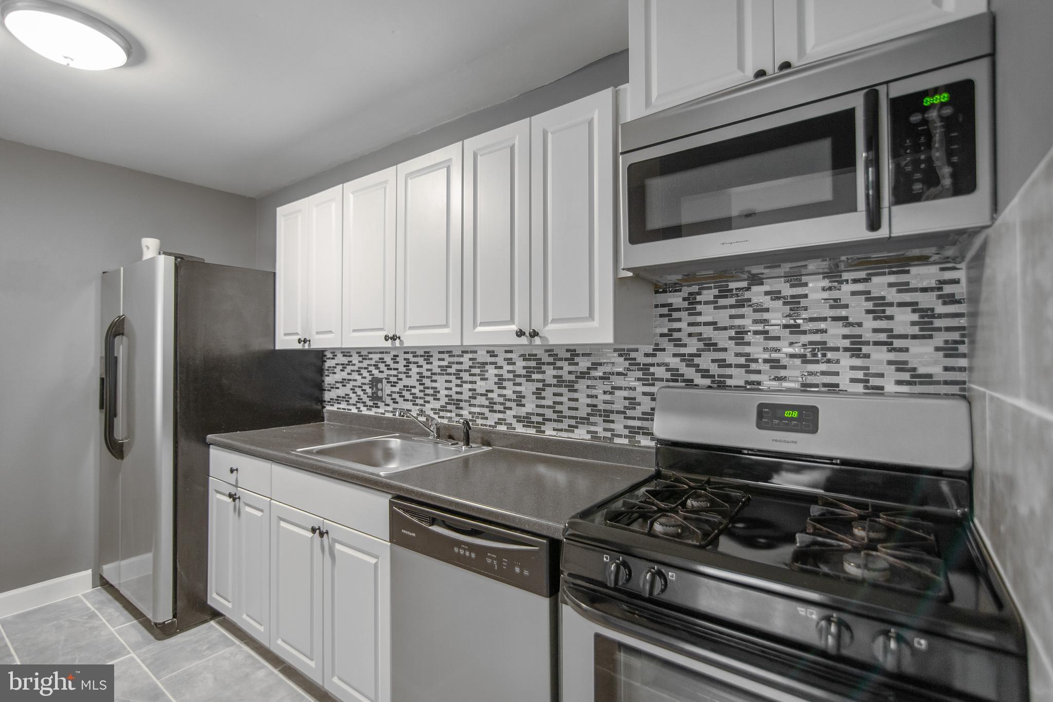 Gorgeous remodeled condo in Bethesda Park with updated kitchen, fresh paint and much more. Kitchen boasts new cabinets, mosaic backsplash and ceramic tile, and newer stainless steel appliances. Recently installed LED lighting fixtures and usb wall outlets. Located walking distance to metro and Pike & Rose Shopping center. Community pool. Condo fee includes all utilities!