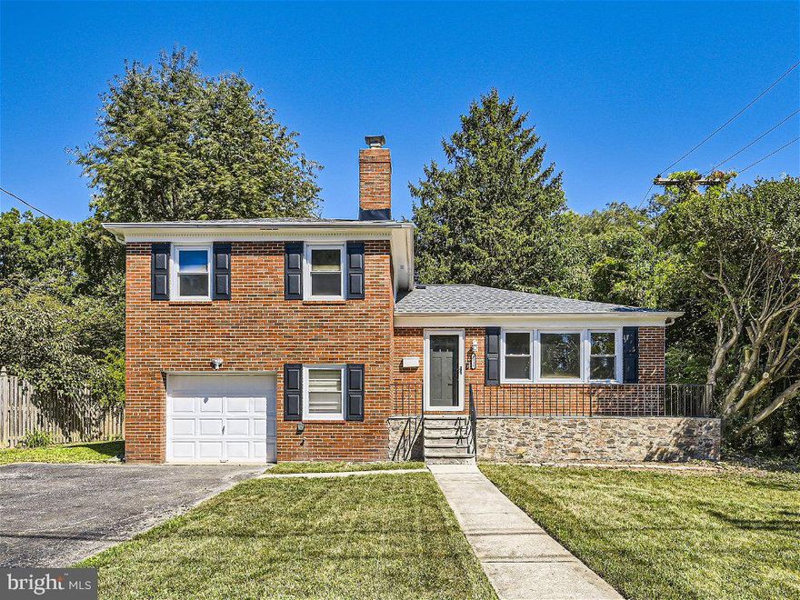Welcome Home to this Beautifully Renovated Bi-Level with Perfect Space and is Open and Bright! Front Porch has plenty of space for Cute Outdoor Furnishings, and Beautiful Flowers that will LOVE the Sunshine! Enter through the New Gorgeous Front Doors!   Refinished Hardwood Floors dress the Large Living Room, and Dining Room.  Kitchen has New Eye-catching Granite and Stone, New Garbage Disposal, and a Door to the Back Yard.   Go upstairs where the Refinished Hardwood Floors continue.  Three Bedrooms, with nice Closet Space, and plenty of Windows!   The Renovated Full Bath is Stunning!  Downstairs is Cozy and Inviting with Brand New Flooring, and enough room for your Sectional and Big Screen! Walk out from the Lower Level to the Back Yard which is Big and Private and Perfect for Entertaining.  Really Great Convenient Location. Come and take a peek TODAY!