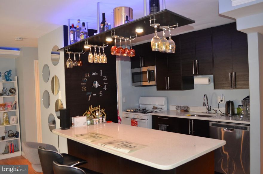 Back to the Market,Beautiful Spacious Two bedroom unit, All Renovated,extended dining space; Great flooring for easy cleaning. Separate storage space in lower level of the building; as well as washer/dryer room. 2 assigned parking spaces. Condo fee includes electric, gas and water as well as access to pool.Bar ,Beautiful Bar Stools,Big mirror at the living Area and some decorations convey with the Unit,. Just minutes away to downtown DC, MGM National Harbor, 495 and other major routes surrounding MD & VA. Condo fee includes Electric, Water, Gas, Common Area, Onsite Management, Community Pool.  Agents please use all Covid19 restrictions when showing.