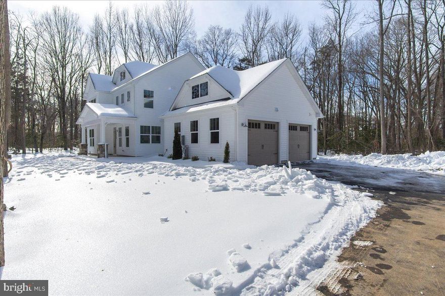 Property will be Active and ready for showings on Friday, February 6. Public open houses will be hosted on Sat 2/7 from 11am-1pm and Sun 2/8 from 12-2pm. ***BRAND NEW & READY FOR IMMEDIATE OCCUPANCY*** this stunning Arts & Crafts home by Laine Street Homes blends timeless design with modern luxury. Set on a premium 2.3 acre homesite surrounded by mature woodlands, this property offers both privacy and functionality. Step onto the welcoming front porch and into a thoughtfully designed main level featuring a private office, formal dining room and a spacious family room highlighted by large picture windows and a modern gas fireplace. At the heart of the home, the gourmet eat-in kitchen impresses with premium quartz countertops, herringbone tile backsplash, tasteful high end dove and pistachio cabinetry with dovetail joints and soft-close drawers, a walk-in pantry, farmhouse apron sink, and a large island with breakfast bar. Upstairs, the primary suite overlooks the private backyard and offers seasonal water views, luxury vinyl plank flooring, a walk-in closet, and a spa-inspired ensuite bath with a 7x6 walk-in shower boasting dual shower heads and floor-to-ceiling tile. Additional highlights include 7-inch LVP flooring throughout the main level, shake siding with stone column bases, public sewer, 2x6 construction, Pella windows, ceramic tile in all baths and laundry, high efficiency tankless water heater, 92% efficient HVAC system, and 30-year architectural shingles. With no HOA or restrictive covenants, this home offers rare flexibility and freedom in a highly desirable Anne Arundel County location, convenient to both Annapolis and Washington, D.C.