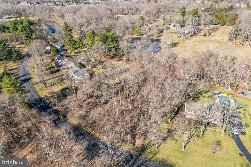 "Welcome to 137 Pebble Woods Drive—An extraordinary opportunity to build your dream home in one of Doylestown's most sought-after and established neighborhoods. Set on a serene, wooded 1+ acre lot, this property perfectly blends natural tranquility and modern convenience. Picture yourself surrounded by mature landscaping and peaceful woodlands, yet just 5 minutes from Main Street Doylestown, where you'll find the area’s top restaurants, charming boutiques, and vibrant community amenities.
The generous lot size easily accommodates a 4,000 sq ft custom home with a 3-car side-entry garage. The building envelope fully complies with Doylestown Township’s R1 zoning ordinance, ensuring a smooth path to construction without the need for additional approvals.
Offering an unmatched combination of serenity and accessibility, this property is truly a unique opportunity in an established community.
Private water and sewer will be required, and the on-site septic system will need to be coordinated with the Bucks County Health Department.
Don’t miss this chance to create your ideal home in a setting that offers the best of both worlds—a peaceful retreat with unmatched proximity to the heart of Doylestown."