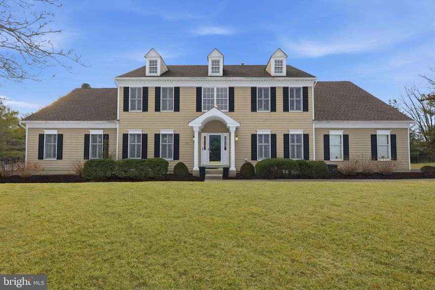 Situated on one of the most picturesque streets in Lower Makefield, this stately residence commands exceptional curb appeal on a beautifully maintained 1.18-acre lot in the sought-after Dolington Estates neighborhood. The grand home at 2018 Silverwood Drive is a sight to behold. A long, elegant driveway leads to a spacious three-car garage, setting the stage for the premium cement board siding, mature plantings, and meticulously curated landscaping that define the exterior. Follow the walkway to the covered entry and step inside, where rich hardwood floors span most of the first level, and a dramatic central staircase creates an immediate sense of arrival. Flanking the foyer are formal living and dining rooms adorned with crown molding, chair rails, and expansive windows that bathe the spaces in natural light and make these rooms ideal for hosting gatherings or enjoying a quiet retreat. At the heart of the home is the stunning open-concept kitchen, thoughtfully designed for both everyday living and entertaining. A striking coffered ceiling crowns the space, while quartz countertops, abundant hardwood cabinetry, a dedicated pantry, built-in ovens, and a large island with a gas cooktop and electrical outlet provide both beauty and function. From the kitchen sink or sliding glass doors, take in views of the professionally designed Bluestone patio and terraced stone patio beyond, expertly installed by Gasper. This private outdoor oasis is perfect for morning coffee, al fresco dining, or future enhancement with a pool. The fenced yard adds peace of mind for pets and young ones alike. The oversized family room serves as the home’s central gathering space, featuring a vaulted ceiling, a cozy brick-surround gas fireplace, and a deep window ledge ideal for relaxed seating. Just off this space is a generously sized office, allowing for seamless work-from-home living while remaining connected to the main living areas. Completing the first floor are a convenient half bath, a laundry room that doubles as a mudroom with garage access, and a versatile bonus room off the garage that can be used as a studio, a second office, a fitness room, or a yoga space. Upstairs, the primary suite is a true sanctuary. This expansive retreat boasts tall windows, a vaulted ceiling, recessed lighting, and an adjoining bonus room well-suited for a nursery, home office, or private gym. The spa-inspired ensuite bath features double vanities, a walk-in shower, and a luxurious soaking tub, while the exceptionally large walk-in closet easily accommodates an extensive wardrobe. The remaining bedrooms are equally generous in size, filled with natural light, and share a beautifully appointed hall bath.
The finished walk-up basement extends the home’s living space even further, offering private exterior access, a fifth bedroom, a full bath, a sauna, and a comfortable living area complete with a second gas fireplace and an entertainment bar. Additional peace of mind comes from a whole-house Generac generator. Set on over an acre of private, landscaped grounds, this exceptional property offers space, comfort, and timeless elegance in one of Lower Makefield’s most desirable locations. Don’t miss the opportunity to experience this remarkable home before it’s gone.