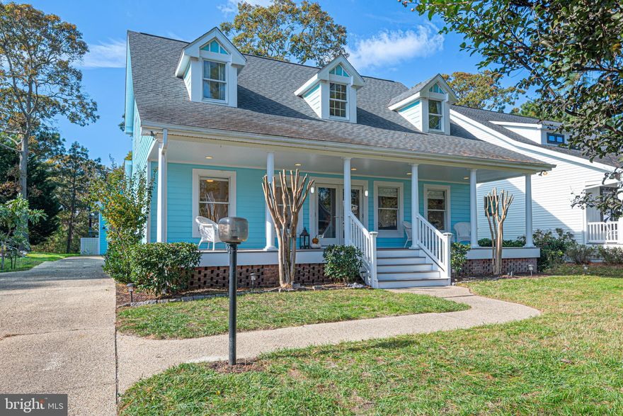 Beautiful Southern charm coastal home in The Salt Pond community features 5 bedrooms and 2 1/2 baths. Enjoy the southern charm of a large front covered porch as you step into an open foyer with vaulted ceiling.  Inside on the main level you will discover a spacious living room, formal dining room, lovely kitchen with large pantry. The master suite is located off the living room with private bath and walk in closet. Past the kitchen is a cozy family room with pellet stove to curl up with a book or just step outside to a patio with fire pit and pergola and a spacious private backyard. Not to be missed on the main level is a half-bathroom and spacious laundry room that offers easy access to the detached oversized garage with second level offering a ton of storage. As you move upstairs you will enjoy 4 bedrooms and a spacious full bath. This well-loved home is ideally located on Oyster Shell Cove which backs to the Loop Canal. The Salt Pond offers indoor and outdoor pools tennis and pickleball courts, play area, community kayak launch and a community Recreation Center with an executive 18-hole golf course. You'll find all this within a mile to the beach. This is a primary home for the seller please call for your private showing today.