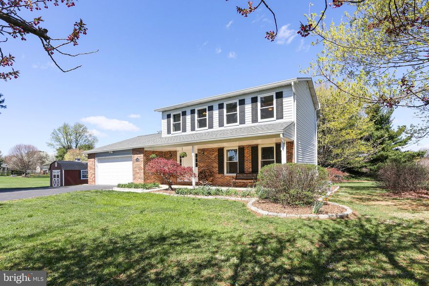 Welcome to this meticulously maintained colonial on 3 beautifully landscaped acres in Marriottsville! Many upgrades including a modern kitchen with maple cabinets, quartz countertops, new refrigerator, stunning bamboo floors throughout the main level, large gas fireplace with brick surround and new built-in shelves in the family room, as well as ceiling fans throughout. Structural updates include a new roof with gutters and gutter guards (2015), windows and patio slider (2016), HVAC with gas furnace (2020), tankless gas hot water heater (2022), and expanded driveway. Other amenities include an oversized 2 car garage and spacious primary bedroom with private full bathroom and walk-in closet. There is laundry on the main level with the option to move the laundry to the basement where washer/dryer hookups are already in place. The walk out basement offers plenty of storage, a utility tub, and a 300 square foot recreation room with built-in shelves. Outside, you will find beautiful flower beds, lots of open space and gorgeous views of the countryside. Features include a new shed with electricity and a workshop, a fire pit, and a fenced-in chicken coop with a small orchard. There is public water and a septic tank. The location can’t be beat with easy access to route 70 and only about 30 minutes to Fort Meade, yet adjacent to farmlands and horse pastures. There is no HOA. Located in a quiet neighborhood within a highly sought after Howard County School district.  Don’t miss this opportunity!