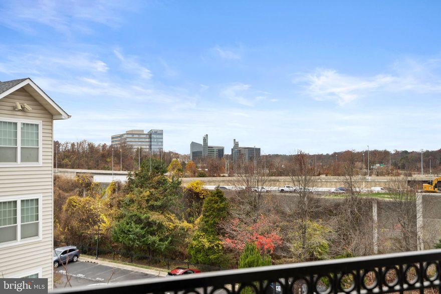 This is the definition of location!  Walk to Wegmans, Tysons, Metro, Capital One.  You are in the heart of it all.  Lovely renovated condo on top floor in secure building.  It even has a view!  Lovely gas fireplace to cozy up in front of.  Brand new appliances just waiting for the new chef.  Great sized bedroom with walk-in closet.  Newer (last three years) furnace and hot water heater.  AND a garage spot.  What isn't to love?  Condo fee shown is the one beginning in January, 2026.