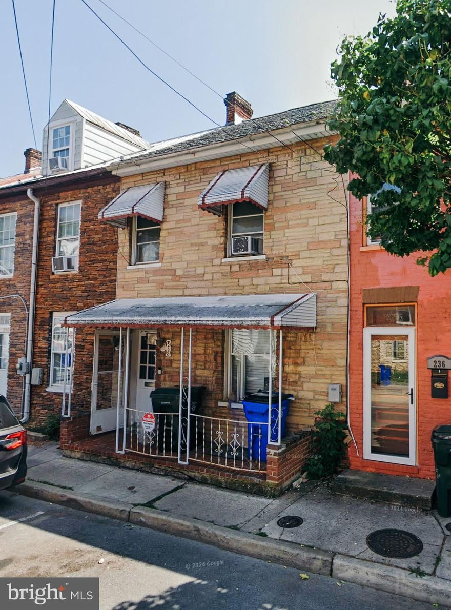 This row house offers two bedrooms, a bonus room on the upper floor, and a bathroom. The main floor includes a cozy living room, a dining area, and a kitchen. It's a great opportunity for first-time home buyers or investors.