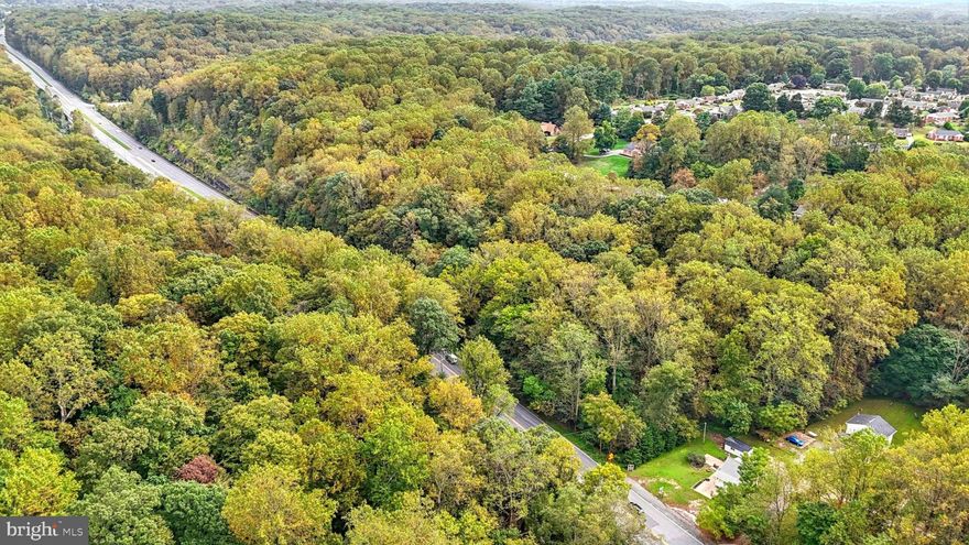 2 PARCELS — COMMERCIAL / RESIDENTIAL — Rare Kingsville opportunity at the Perry Hall line! This fully renovated 3BR, 1BA Cape Cod (1,010 sq ft) sits on a high-visibility Bel Air Rd parcel zoned BL (Business Local), offering exceptional flexibility for commercial, live/work, or investment use. Perfect for a small business, office, salon, or boutique, while also move-in ready for those seeking a unique live/work setup. Major updates include a new roof (2024) and extensive improvements in September 2025, featuring brand-new Pergo luxury vinyl plank flooring throughout, fresh interior paint, the front porch stained white with new lighting, new rear porch lighting, gutter guards installed all around, and a fully dry-locked basement. The site offers ample front parking plus a shared side driveway leading to additional parking on a rear pad with direct access to the backdoor — ideal for clients, staff, or deliveries. A traffic survey conducted February 24 – March 15, 2022, recorded 88,875 vehicles passing during that period, highlighting the property’s outstanding exposure and strong commercial potential along Bel Air Rd. Also included is an adjacent .60-acre parcel with a scenic stream, mature trees, and direct access to Gunpowder Falls State Park — a rare bonus providing natural appeal, a privacy buffer, or possible future development opportunity (buyer to verify with Baltimore County). With its prime Bel Air Rd frontage, flexible zoning, and extensive updates, this property is a turnkey opportunity for a variety of uses in one of the most visible and sought-after sections of Kingsville.