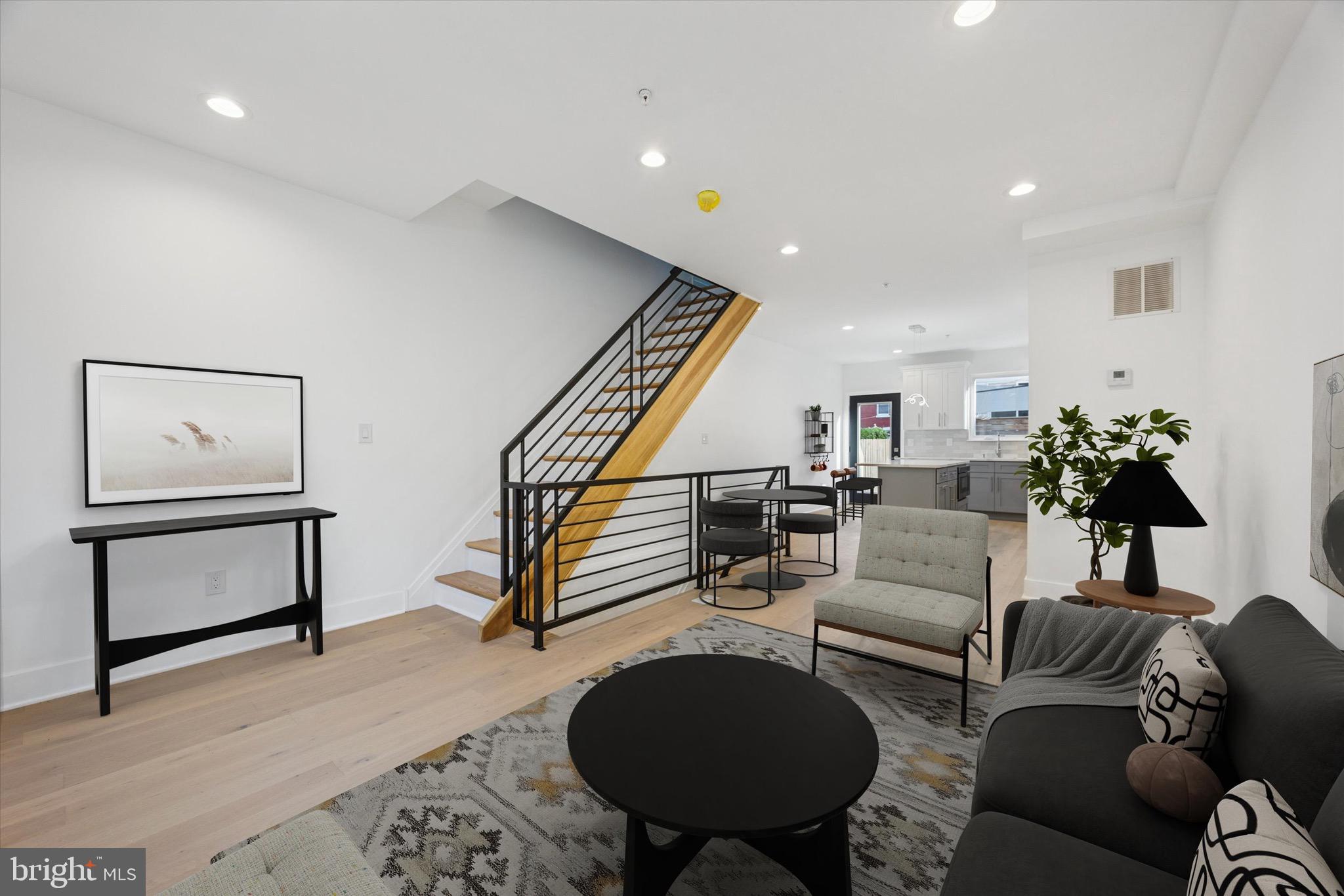 Brand new construction building that comes with 1 year builders warranty in the Passyunk area of South Philadelphia is now available! This four-bedroom, three-bathroom home features hardwood flooring, granite countertops, stainless steel appliances, and custom metal railings. The open first floor has a living and dining area with a large kitchen, breakfast bar, and ample cabinet space. The second floor includes a laundry room, two bedrooms, and a bathroom. The third-floor master suite boasts a walk-in closet and a bathroom with a large shower. The finished basement offers a fourth bedroom and a full bathroom. Enjoy a fiberglass roof deck with stunning city views and a back patio perfect for entertaining or gardening. Near the Bok Building and Passyunk ave, tons of shops and restaurants all within walking distance ! Schedule your showing today !