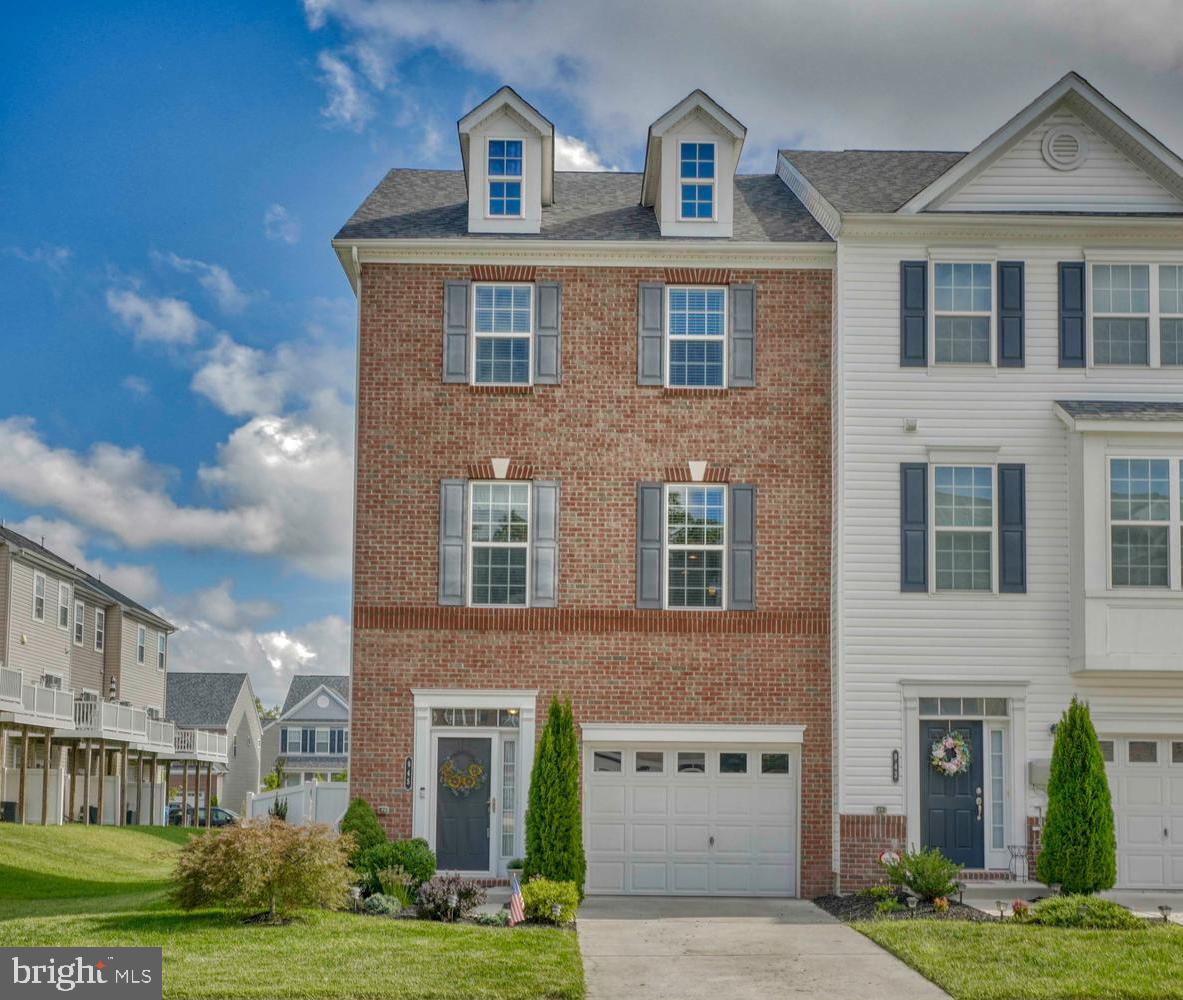 Well appointed end townhome in desirable Windlass Run. Entry level features large living space with garage, perfect for a workshop or home gym! Step upstairs to the main level with an expansive open floor plan. Gorgeous hardwood floors and a perfect gourmet's dream kitchen. End unit provides extra windows for a ton of natural light. Stainless high end appliances and large pantry finish off a kitchen that will be the central gathering place for every event. Top floor provides a huge primary bedroom and a wonderful bathroom suite with tile and stone finishes. Head to the back yard with great deck for entertaining and fenced in rear yard for privacy. This house is perfect from top to bottom! Minutes to all the new and exciting shopping and restaurants on the 43 corridor and moments to major highways.