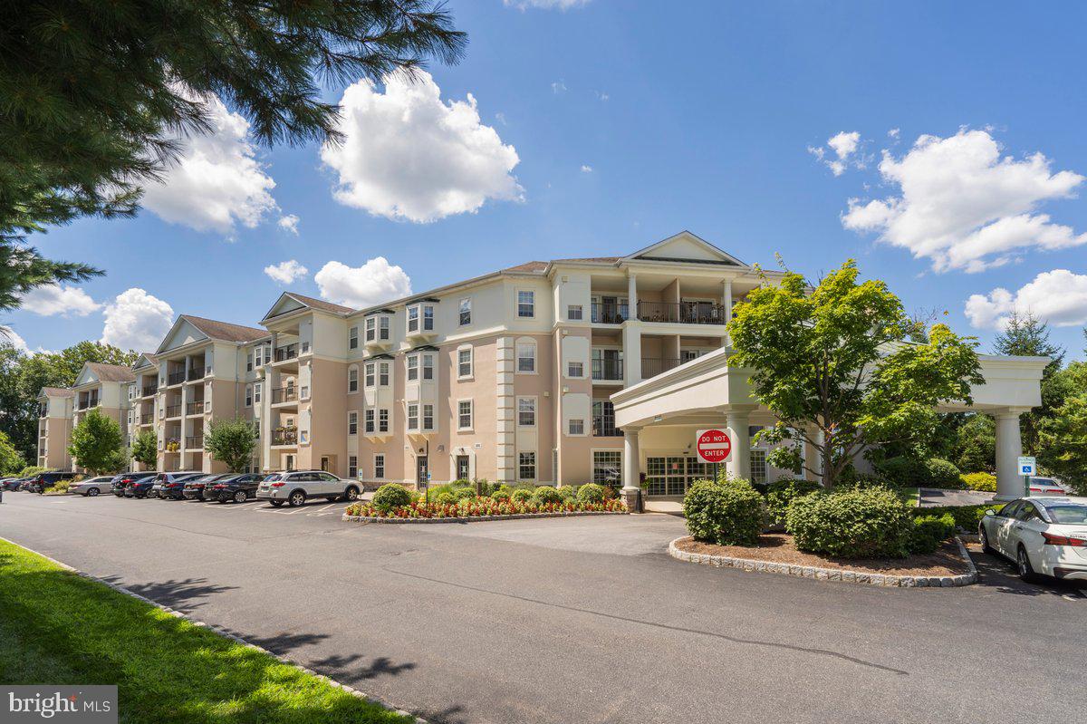 This meticulously maintained unit which overlooks open space and slightly off to the right the pool will enhance your life style and relax your mind as you sit on the balcony with either your early morning coffee and or that happy hour beverage. Upon entering the front door you will be embraced by a spacious foyer with a double closet and pillars that’s sets the stage for the open floor plan with hardwood floors throughout. The dining room, living room, and kitchen are all open to each other making it awfully perfectly for easy entertaining. Some of the outstanding features are the decorative lighting, new marble black splash in the kitchen, flat top stove, garbage disposal, dishwasher, and breakfast bar. The laundry room is off the kitchen where you will find the newer hot water tank and enough area to store some of your cleaning supplies. Both full baths have ceramic floors and the higher vanities of today’s world. Both bedrooms are spacious and the primary bedroom has a wonderful walk in closet and is well lit naturally by Mother Nature. Off the balcony there is a large storage closet which holds the HVAC and plenty of room for patio furniture. Don’t miss this wonderful opportunity for one floor living in an elevator building. This unit does not have a separately deeded underground parking space. Possibility of privately renting from "snow birds" in the winter who travel out of the area.
--