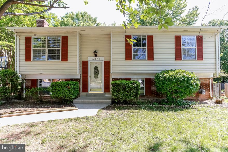 Beautiful 4 bedroom single family home!  Freshly painted and features new carpet in basement, updated kitchen, hardwood floors, wood burning fireplace, spacious bedrooms, newer roof and more!  Located close to shopping, schools and commuter lot!