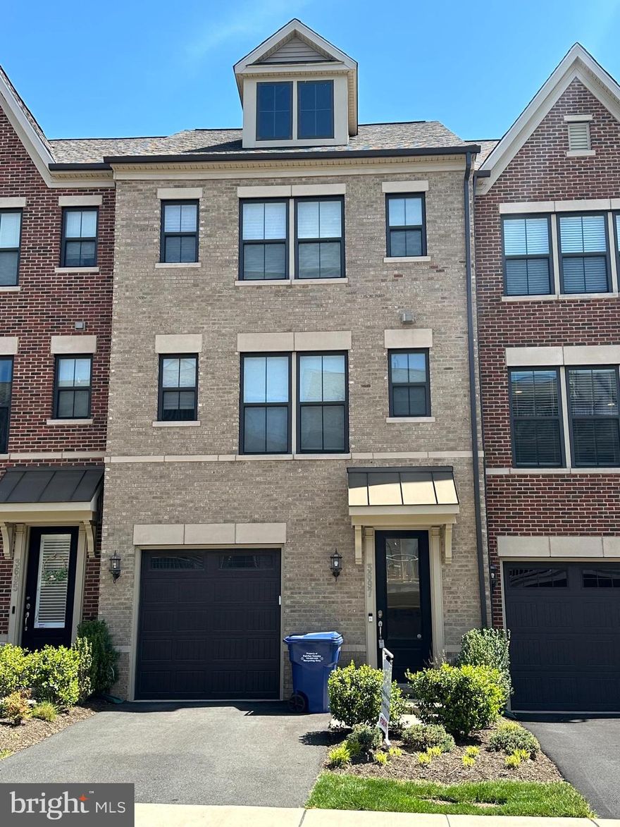 Welcome to this stunning, light-filled 4-level townhome with a 1-car garage, ideally situated in the desirable Ambrose Hills community near Bailey’s Crossroads and Lake Barcroft. Built in 2017 and meticulously maintained, this energy-efficient home feels brand new and perfectly combines modern elegance with everyday comfort and convenience.
Inside, you’ll find 3 spacious bedrooms and 3.5 baths, each bedroom offering its own full bath and walk-in closet for ultimate privacy. The entry level features a welcoming foyer and a bedroom suite with direct access to the grassy backyard that opens to a serene green common area.
The main level showcases an open-concept floor plan with a gourmet kitchen boasting stainless steel appliances (including a double oven and gas cooktop), a farmhouse sink, decorative backsplash, large island, coffee bar plumbed for water, abundant cabinetry, and a separate pantry. The kitchen flows seamlessly into the bright dining and living areas, which open to a private deck—perfect for grilling, relaxing, or gardening.
Upstairs, the laundry area is conveniently located on the same level as two generous bedroom suites. The primary suite features a walk-in closet and a spa-inspired bath with a glass-enclosed shower with bench seating and a dual vanity. The guest suite offers its own full bath and a large, sunlit closet.
The top-floor loft provides a flexible space ideal for a home office, media room, or potential 4th bedroom. Step outside to the private rooftop terrace, a perfect retreat for lounging or entertaining with privacy and panoramic views.
Thoughtful upgrades throughout include recessed lighting, crown moulding, ceiling fans in every room, quartz and granite countertops, smart thermostats, keyless entry, tinted exterior doors, and superior insulation that keeps utility costs low.
The community features visitor parking, pet stations, lawn and common area maintenance, a playground, and direct access to Holmes Run Park. With quick access to I-395 and I-495, you’re only 12 minutes from the Pentagon or Mark Center, and steps from the Metro bus stop. Trader Joe’s, Target, Starbucks, and numerous shops and restaurants are just minutes away.
Available November 1st. Dogs are considered on a case-by-case basis with a refundable $500 deposit per dog (maximum two). HOA fee (paid by owner) includes trash service.
This stylish, modern townhome offers the best of Falls Church living: comfort, sophistication, and unbeatable location.