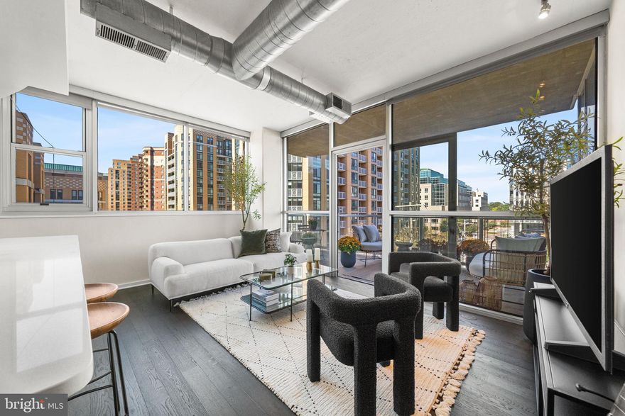 Tucked into the heart of Arlington’s Ballston-Virginia Square corridor, this condo in the desirable ARC 3409 building delivers polished metro living with no compromises. This two-bedroom, two-bath condo spans just over 1,000 square feet, but lives larger thanks to thoughtful design, walls of windows, and an open-concept layout for maximum flow. Interior finishes hit all the right notes including a sleek kitchen with flat-panel cabinetry, stainless steel appliances, and seated bar with quartz countertops that reflect the light. It opens seamlessly into the living area, where massive windows drench the space in natural light and private balcony access offers space for elegant entertaining. Spacious primary suite is anchored by a clean-lined en suite bath with tiled shower. Second bedroom, in-unit laundry and ample closet space make every inch of this home feel intentional. The desirable boutique building features concierge service, gym, and onsite parking, plus close proximity to local coffee shops, nightlife, greenspaces and Metro access. Find everything you’re looking for and more than you expect here, right where you want to be.

Don’t miss the Open House Sat & Sun 1-4.