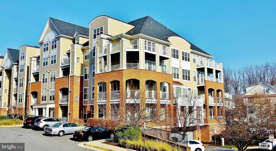 Top Floor Corner Unit W/ Uninterrupted Views, 3 Bedrooms & 2 Full Baths W/Loft. Nicely Updated,  Master Bed W/ Custom Walk-in Closet & Full Bath that Includes a Tub & a Separate Shower. Open Kitchen W/ All Stainless Steel Appliances, Granite Tops, 42" Oak Wood Cabinets & In-Unit Washer & Dryer. Gas Fire Place, Wall Of Windows, Light Filled . Wood Floor Throughout. Double Volume Ceiling, Wraparound Balcony / Deck ( Just been replaced ), Storage space & 2 Garage PK + 2 permits for outside Pk. Walking Distance To Mosaic Shopping & Entertainment. Across The Street From Merrifield Metro Station & Quick Access To  Route 50, 66 & 495.