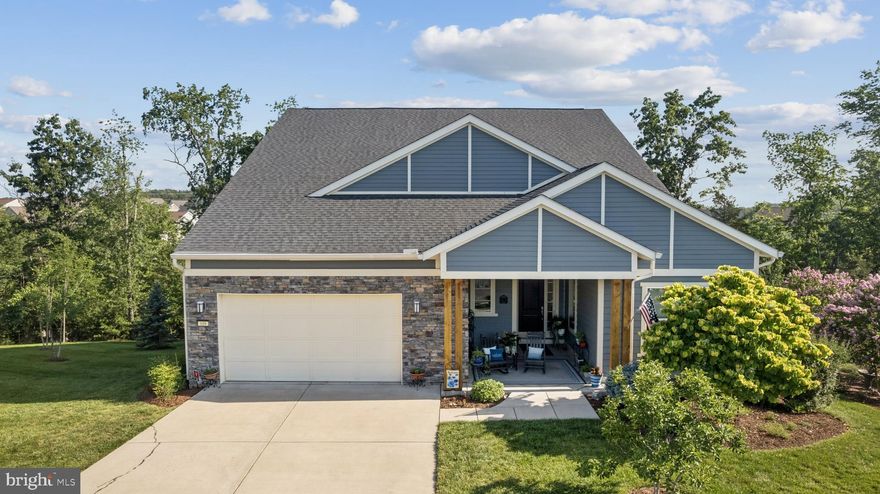 Welcome to this stunning Shea Homes Evoke model, thoughtfully designed for main-level living and nestled on a peaceful cul-de-sac with a serene backdrop of mature trees. Built in 2019, this exceptional residence offers over 4,000 square feet of luxurious comfort, featuring four spacious bedrooms and four full bathrooms, including a handicap-accessible bath with a roll-in shower. Located on the clubhouse side of the community and set on an oversized premium lot backing to trees for greater privacy.
<br><br>

A warm welcome begins at the foyer, where gleaming hardwood floors flow throughout the main-level living spaces. Just off the entry, a private home office is tucked behind frosted glass French doors—perfect for remote work or quiet study. The expansive laundry room is a true standout, equipped with abundant cabinetry, folding counters, and hanging space to keep everything in its place.
<br><br>

At the heart of the home, the gourmet kitchen is a chef’s dream with Shea's Signature Kitchen upgrade package. Beautiful granite countertops, mosaic tile backsplash, and stacked cabinetry pair seamlessly with high-end stainless steel appliances—including a 2024 dishwasher and gas cooktop. A massive center island with seating and storage anchors the space, which opens to a spacious great room with a cozy gas fireplace and built-in bookshelves, ideal for everyday living and entertaining.
<br><br>

Enjoy tranquil outdoor living on the full-length covered deck, where wooded views offer unmatched privacy. Below, a custom stone patio—accessed via a charming spiral staircase—features a built-in firepit and retaining walls added in 2020, setting the stage for memorable gatherings year-round.
<br><br>

The main-level primary suite is a true retreat with two walk-in closets, plush carpeting, and captivating views. The spa-like bathroom offers dual vanities, a soaking tub, and a walk-in shower. Two additional main-level bedrooms each enjoy their own private full bathrooms, offering comfort and privacy for family or guests.
<br><br>

Upstairs, a large rec room with custom built-ins creates a versatile space for relaxation, recreation, or media. A fourth bedroom and full bath complete this level—ideal for multigenerational living or accommodating guests.
<br><br>

The walk-out basement remains unfinished, providing ample space for storage or future customization. Additional thoughtful upgrades include gutter leaf guards for easy maintenance and a beautifully landscaped lot with generous spacing between homes, enhancing the sense of privacy.
<br><br>

Offering a seamless blend of elegance, comfort, and accessibility, this beautifully upgraded home is an exceptional opportunity for discerning buyers seeking refined living in a peaceful, private setting.
<br><br>
As a resident of Trilogy at Lake Frederick, you'll enjoy a wealth of incredible amenities designed to enhance your lifestyle. Dive into relaxation with both indoor and outdoor pools, stay active in the state-of-the-art fitness center, and unwind at the well-equipped community clubhouse. Savor gourmet meals at the farm-to-table restaurant and socialize in the exclusive members-only lounge. For the sports enthusiasts, tennis and pickleball courts, as well as a dog park, offer ample opportunities for recreation, while extensive lake trails beckon for serene strolls and outdoor adventures. Join a vibrant community of welcoming neighbors and future friends. Experience the pinnacle of resort living at Trilogy at Lake Frederick—where your dream home and ideal lifestyle come together seamlessly.