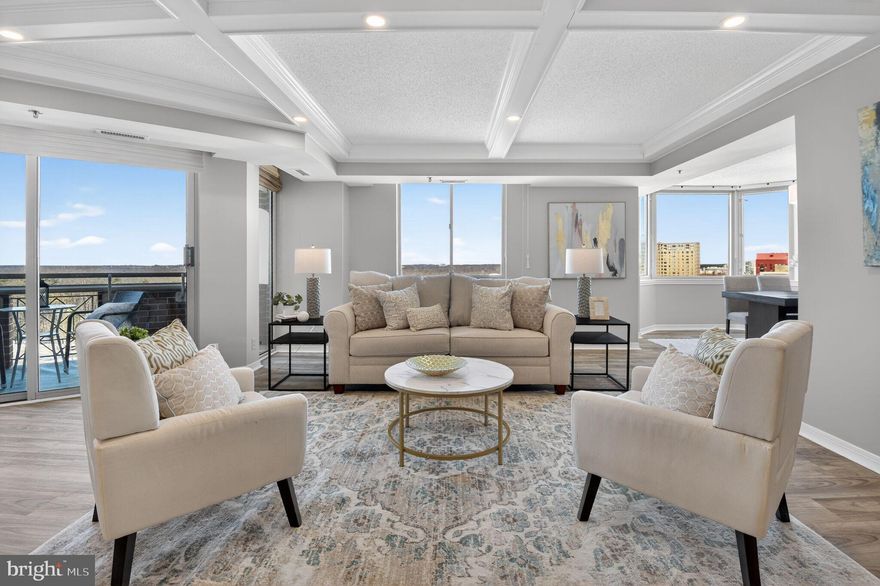 Beatifully updated in 2025, this 3 bedroom, 3.5 bath condo has more than 2,300 square feet of luxury living and 2 deeded, reserved garage parking spaces.  Located in the highly desirable Wisconsin, a gated condominium in N. Bethesda, which was voted the most desirable location in Montgomery county, this spacious home includes beautiful views from its 2 private balconies. Flooded with natural light and agumented by recessed lighting, the open living room has coffered ceilings,  vinyl plank flooring and balcony access.  The chef's kitchen feaures new white shaker cabinetry, elegant quartz countertops, and top of the line stainless steel appliances.  With access to a second private balcony, the primary bedroom is sumptuous and includes an en-suite, fully renovated bathroom with double sinks and a large step-in shower.   The walk-in closet and second closet offer ample storage space. The floor plan insures privacy with 2 bedrooms at the opposite end of the home, one with an en-suite bathroom and a walk -in closet.  A third full bathroom is conveniently located in the hallway with proximity to bedroom #3.  Come enjoy all the amenities the Wisconsin offers its residents:  indoor and outdoor pools, a racquetball court, tennis courts, a sauna, fully equipped weight room, cardio room, yoga studio, men's and women's locker rooms, and close by shopping and restaurants at Pike and Rose.  All major transportation routes are just a short drive away, and the White Flint/N. Bethesda Metro is just a short walk.