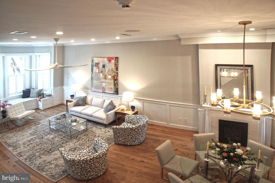 Welcome to 121 4th Street, NE...a magnificent 1885 4 story Victorian Queen blending exceptional contemporary modern luxury with handsome historical craftmanship.  This expansive four bedroom four and one-half bathroom home, with private off-street PARKING for two, was designed for YOU and to accommodate today's demanding living and entertaining lifestyles.  Hang your hat and umbrella in the vestibule or in the closet under the stairs and enter  into its soaring open-plan living and dining room with beautifully stained and refinished quarter-sawn oak flooring  and floor to ceiling French doors opening to the kitchen.  Its kitchen is every chef's dream (sous chef too)...huge center island, extensive BluMotion soft-close cabinetry and storage, Wolf, Miele and Sub-Zero appliances, Caesar stone counters, superb lighting and that essential separate wet bar.  Two dens/home offices/family rooms.  A divinely luxurious owner's bedroom suite with walk-in closet and spa bathroom on the second level and a second generous bedroom and bathroom.  Huge separate laundry room. The top floor features a large luxurious bedroom and full bath, a family room/home office with wet bar and provides  walkout to the two-tiered and wonderfully private roof deck with spectacular views---the Capitol, the Washington Monument, the Supreme Court, Thomas Jefferson's golden flame---the perfect owner's retreat or entertaining venue for 4th of July fireworks.  The lower level English basement one bedroom and bathroom apartment with C of O is perfect as additional income source or guest suite or the returning graduate son/daughter.  Its premier Capitol Hill LOCATION is a walker's paradise---only a short walk to the Capitol grounds and Congress, 3 Red/Blue/Orange line Metro stations, Stanton Park, the Eastern Market, NATS Park, the Mall and 3 Star Dining.  Yes, you can own it ALL! Please visit one of the open houses or call your agent or  Phyllis Jane for a private tour