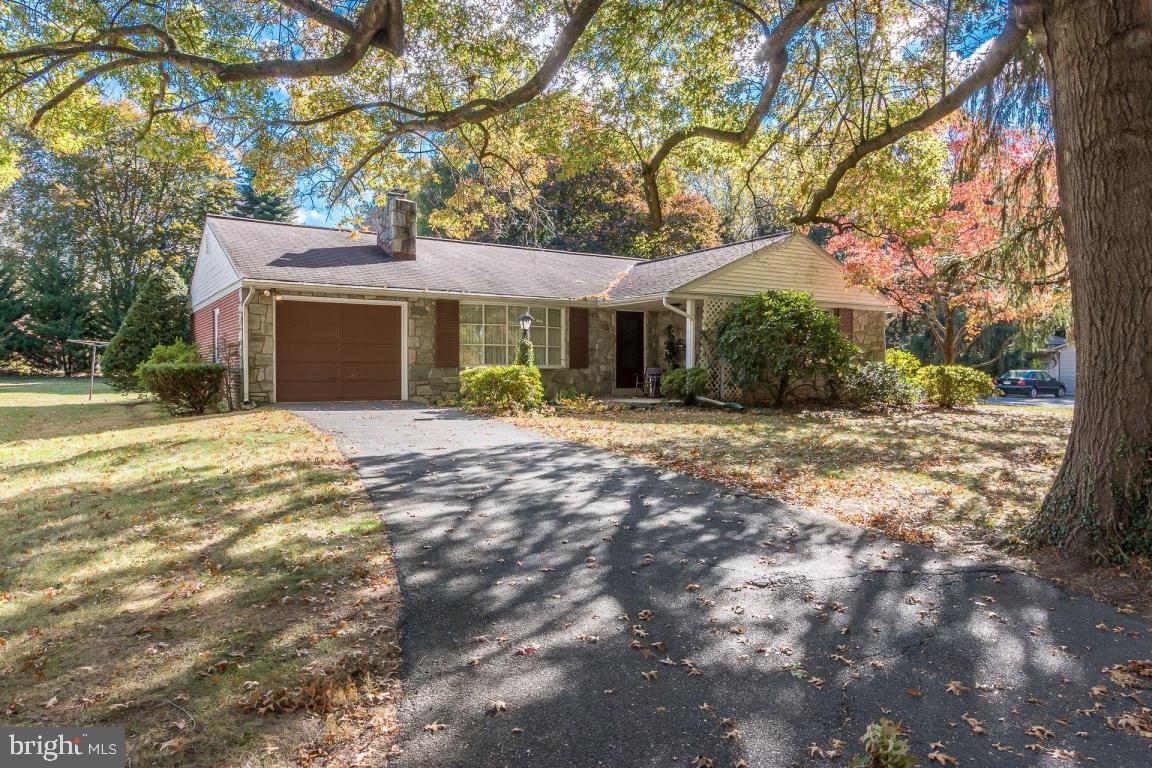 Snuggle up to the cozy fireplace in the living room or enjoy the fresh outdoors while relaxing on the covered porch. This one story home sits on a corner lot with features including beautiful hardwood floors, central air, first floor laundry, garage, and so much more!